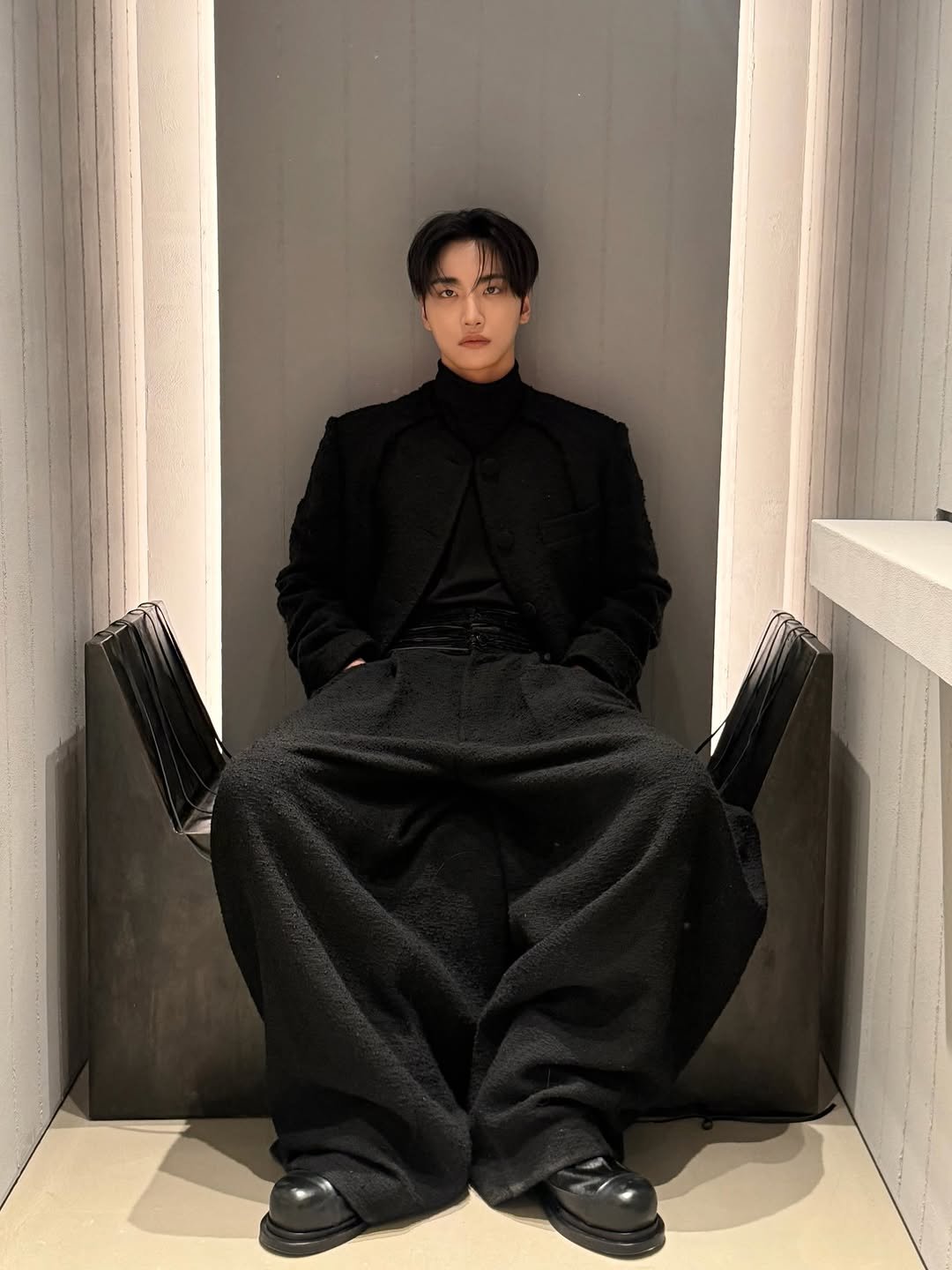 Photo shared by SEONGHWA on January 25, 2026 tagging @songzio_official. May be an image of duffle coat, overcoat, suit, top, bolo tie and text.