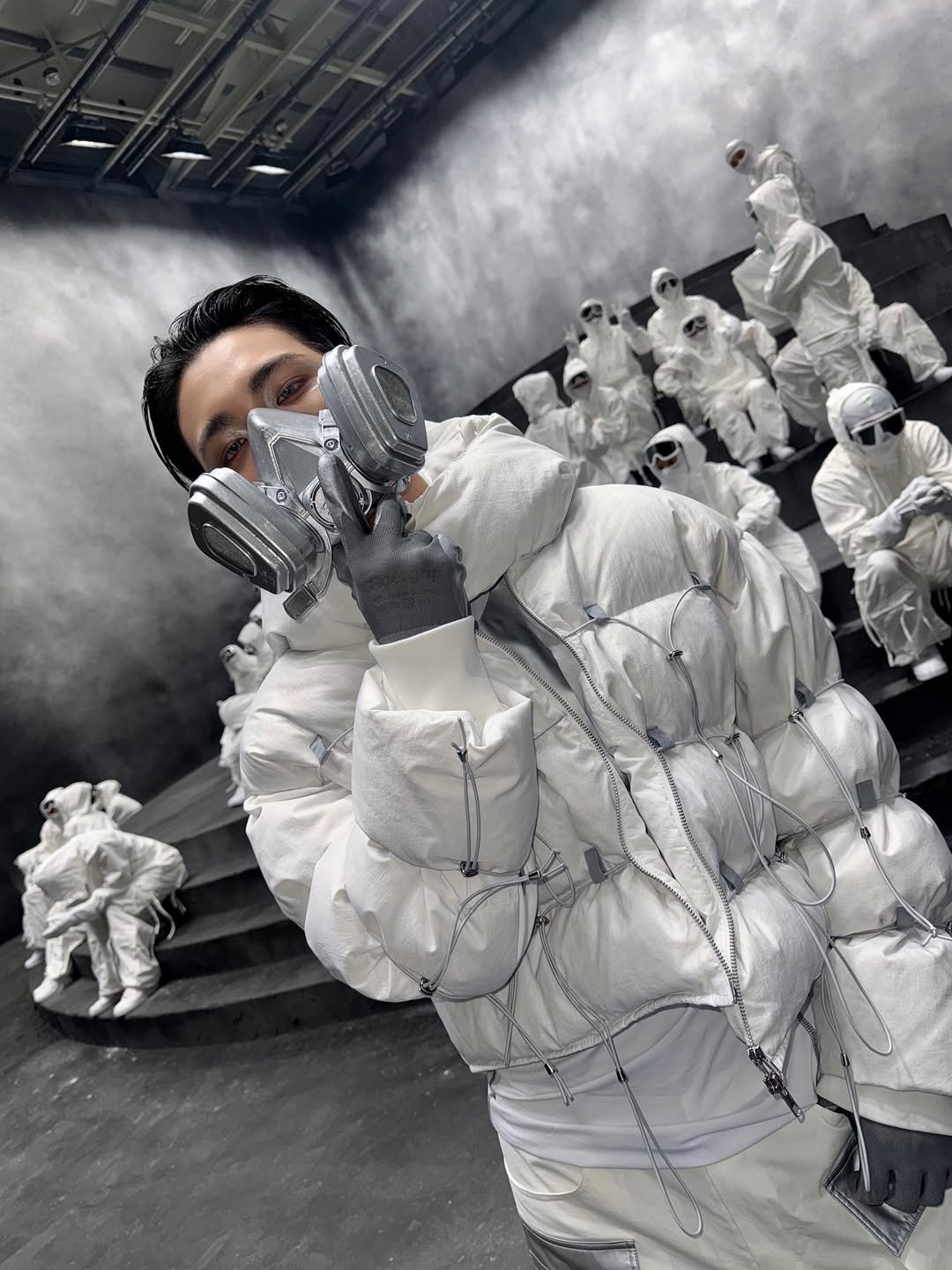 Photo by SEONGHWA on February 23, 2026. May be an image of goosedown coat, overcoat, face mask, sweatsuit, parka, raincoat, snowsuit, gas mask, sculpture and text.