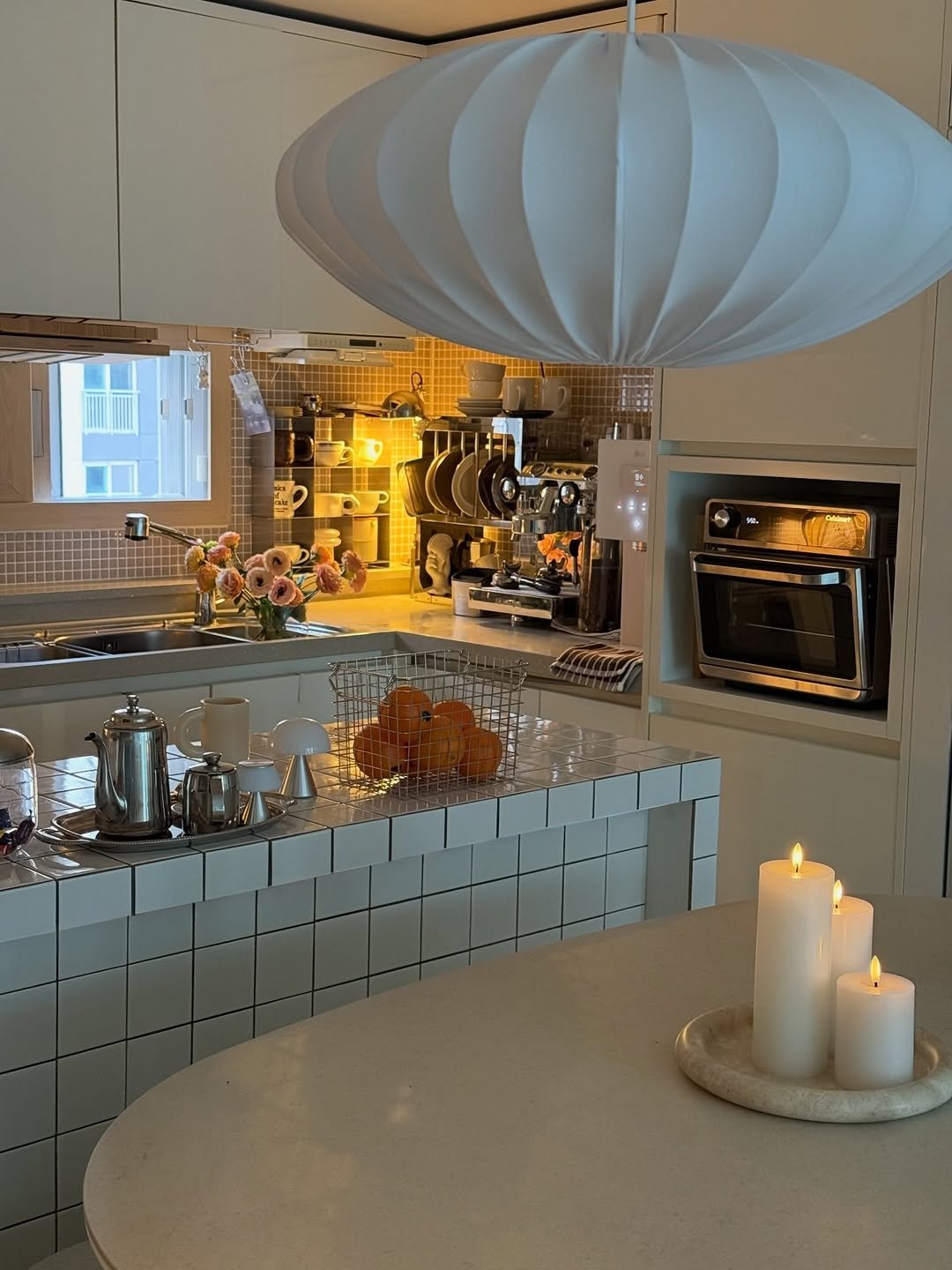 Photo by nini♡ on April 10, 2026. May be an image of kitchen island, lighting, range hood, countertop, kitchen table, indoors, kitchen and text.