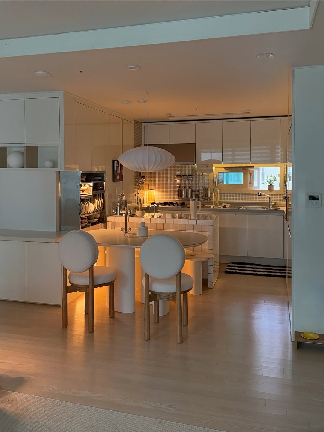 Photo by nini♡ on April 24, 2026. May be an image of lighting, range hood, dining table, kitchen table, indoors, kitchen and text.