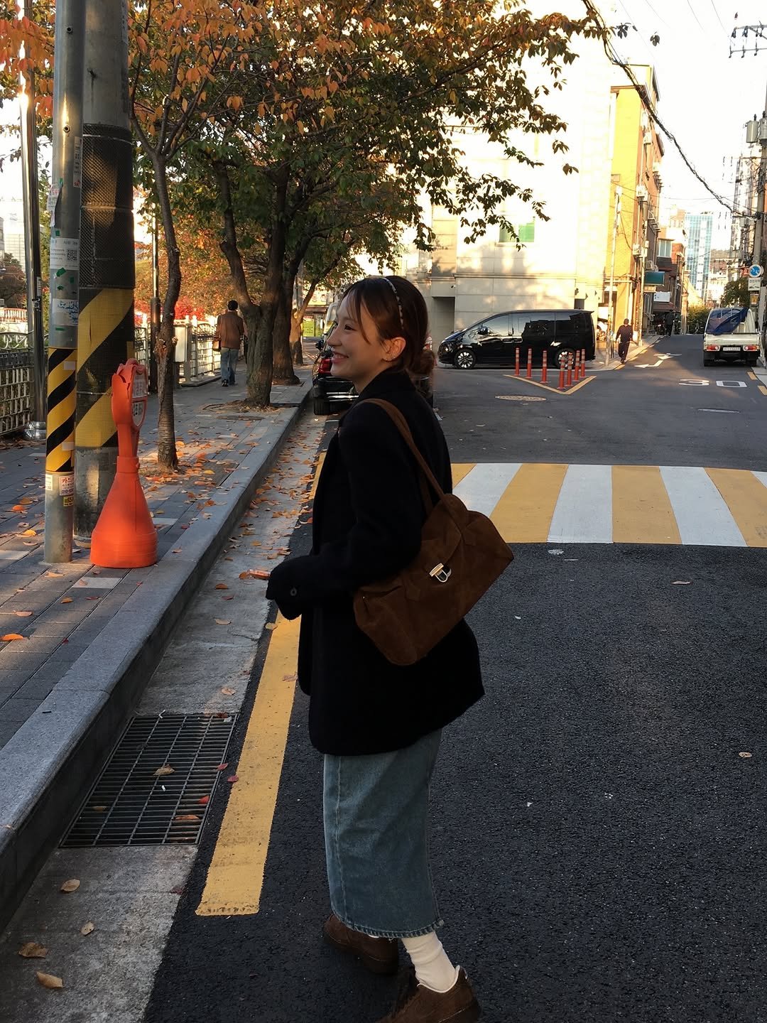 Photo shared by 유니 on November 11, 2025 tagging @ganaesra, and @levar.kr. May be an image of duffle coat, overcoat, street and text.
