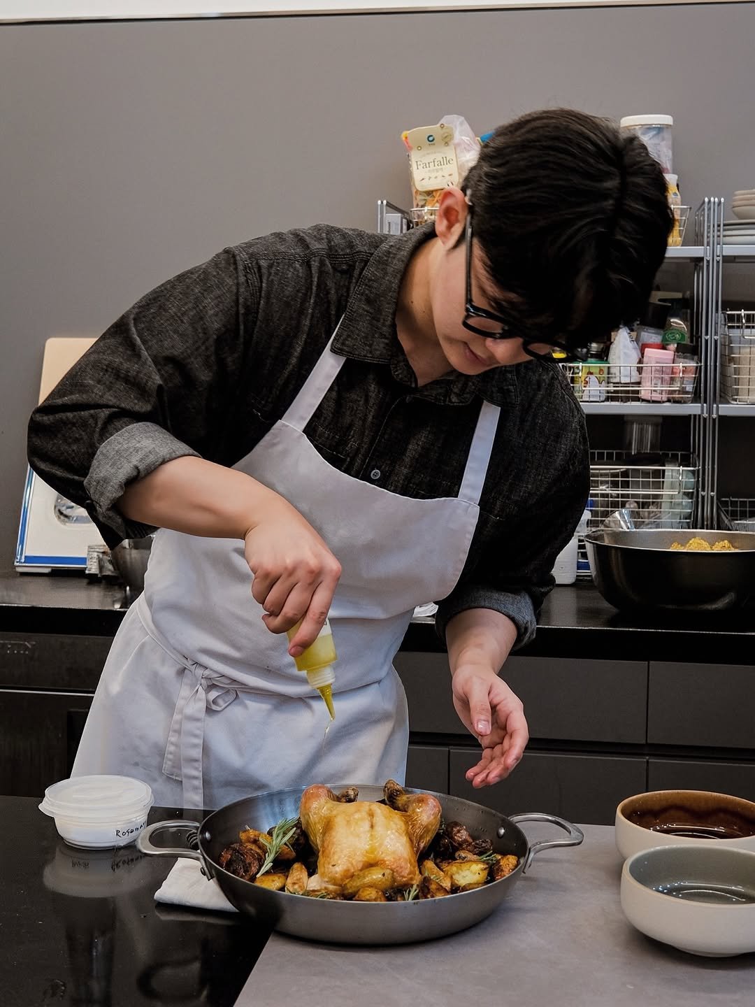 Photo by 한신희 on April 16, 2026. May be an image of food, apron, cooker and text.