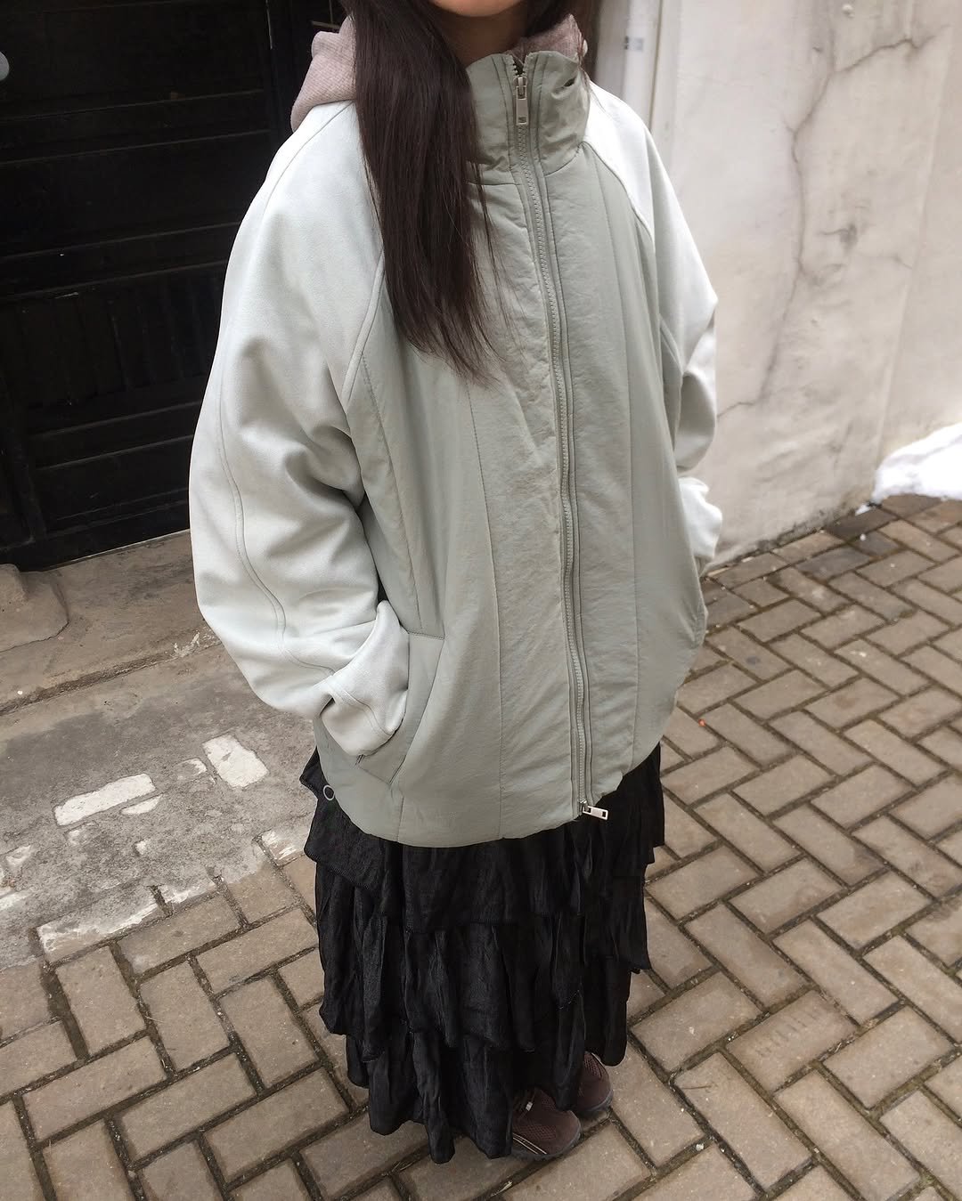 Photo by 예잇 on February 05, 2026. May be an image of duffle coat, overcoat, goosedown coat, jacket, raincoat, parka and text.