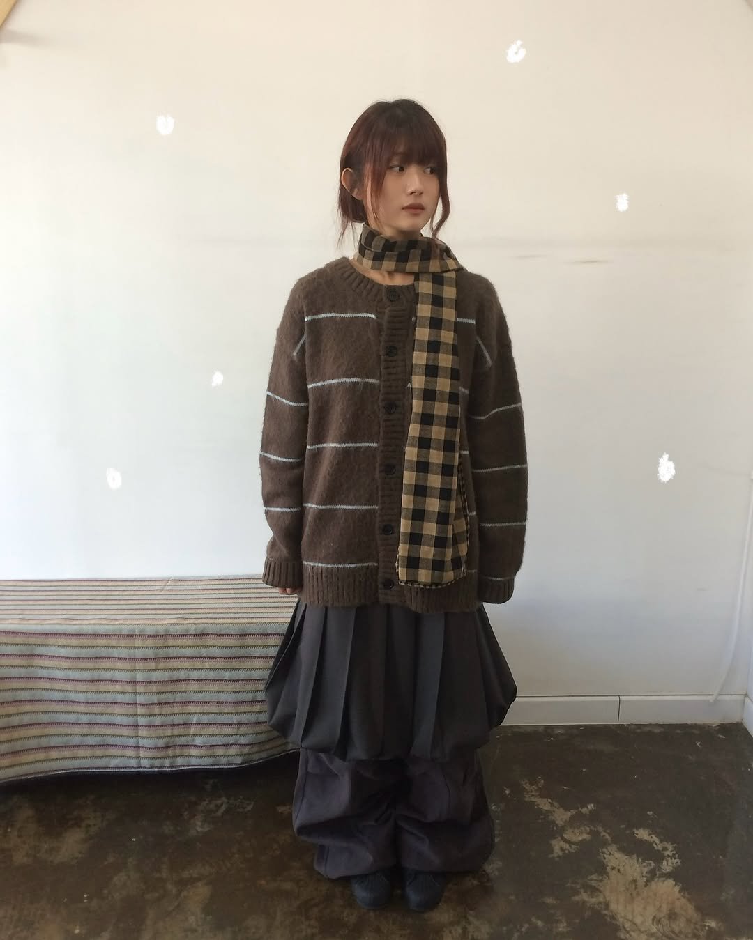 Photo by 예잇 on November 19, 2025. May be an image of duffle coat, overcoat, turtleneck, kilt, wool, parka and text.