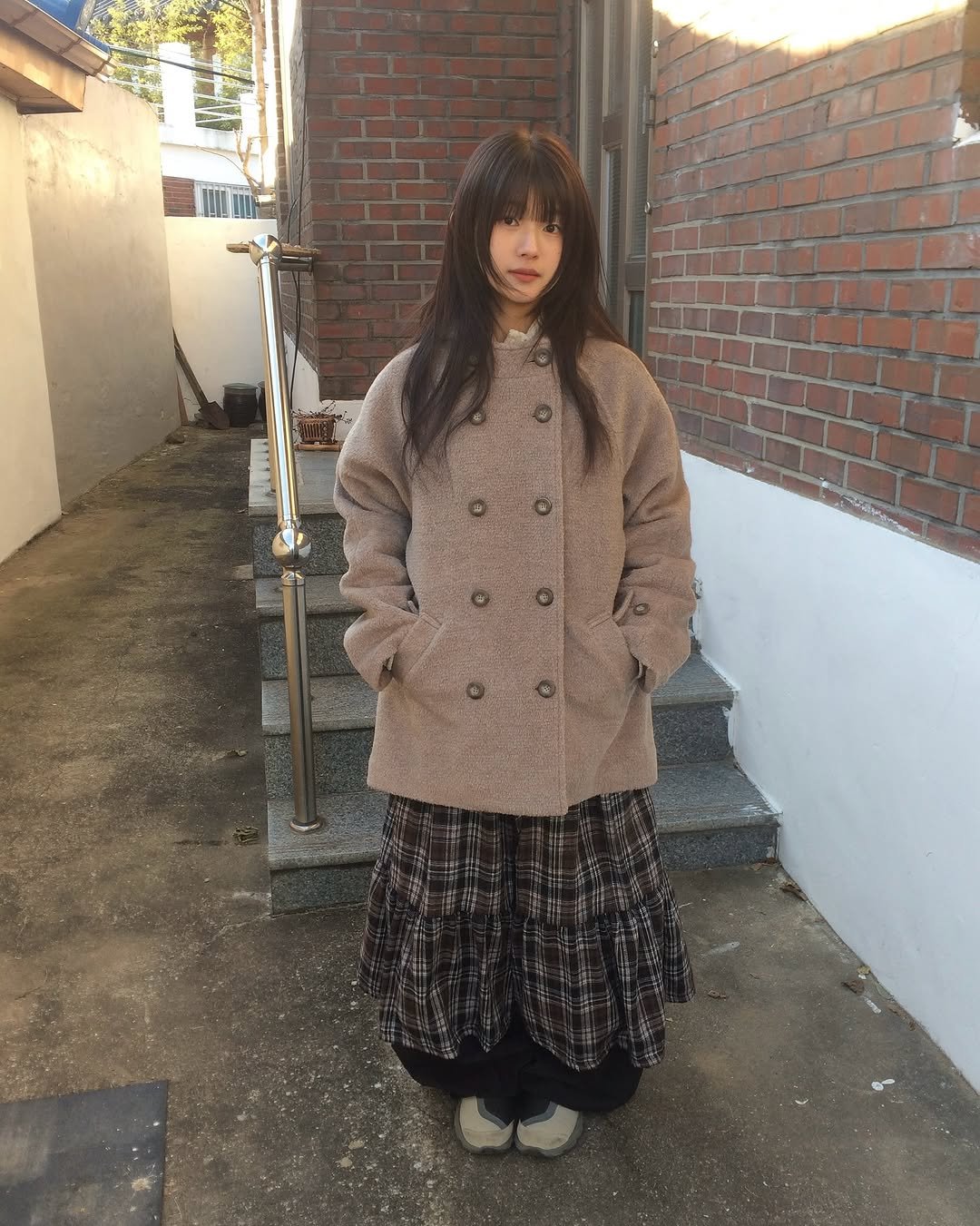 Photo by 예잇 on December 07, 2025. May be an image of duffle coat, overcoat, fur, parka and text.