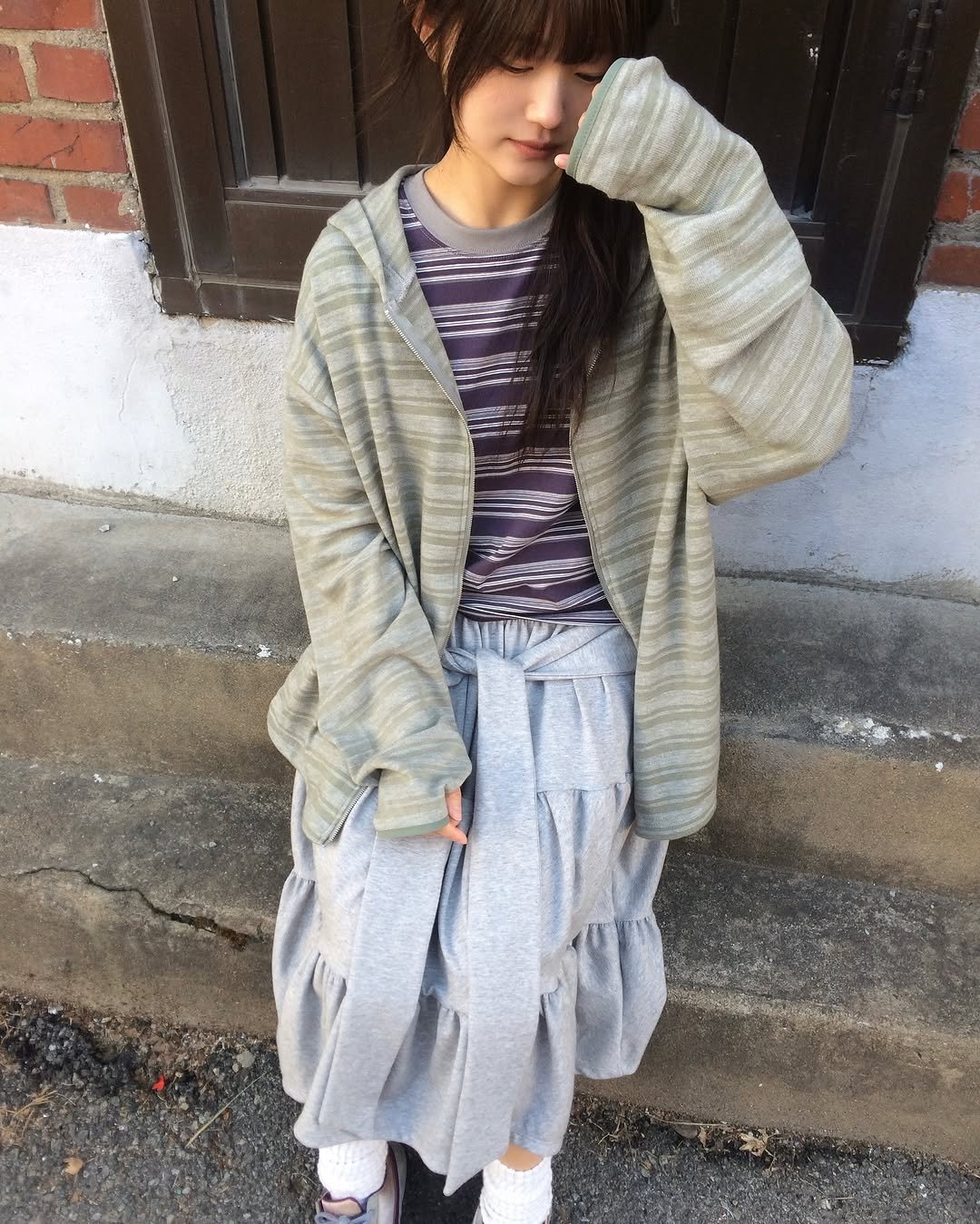 Photo by 예잇 on April 19, 2026. May be an image of duffle coat, cardigan and text.