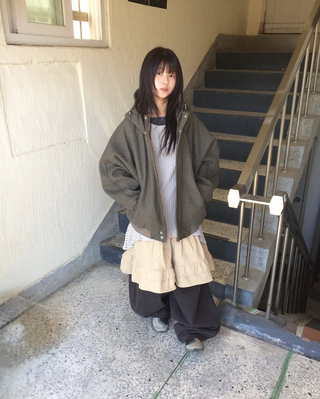 Photo by 예잇 on December 04, 2025. May be an image of duffle coat, overcoat, cloak, parka and text.