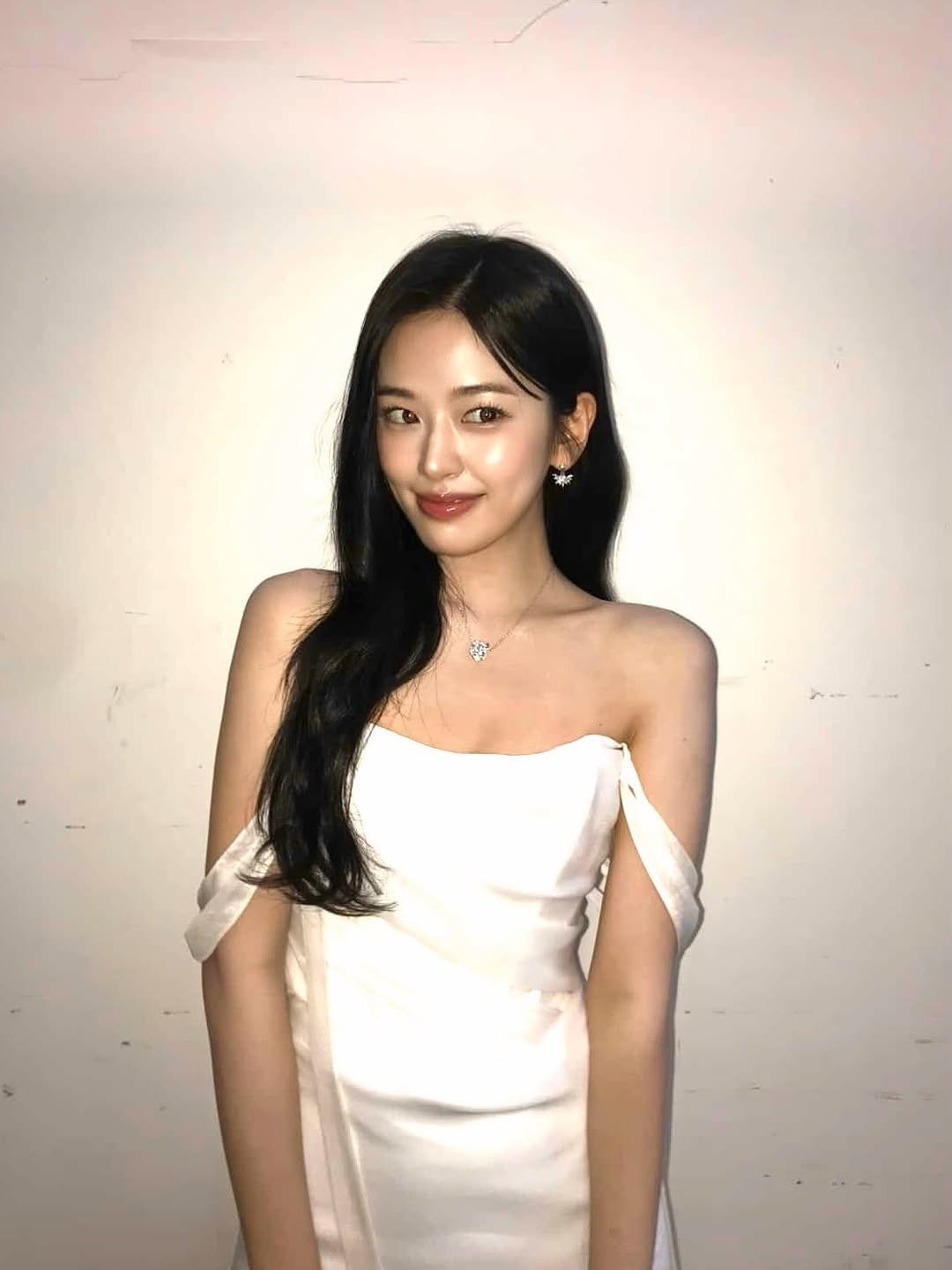 Photo by 안유진 AN YUJIN on January 11, 2026. May be an image of one or more people, hair, dress and text.