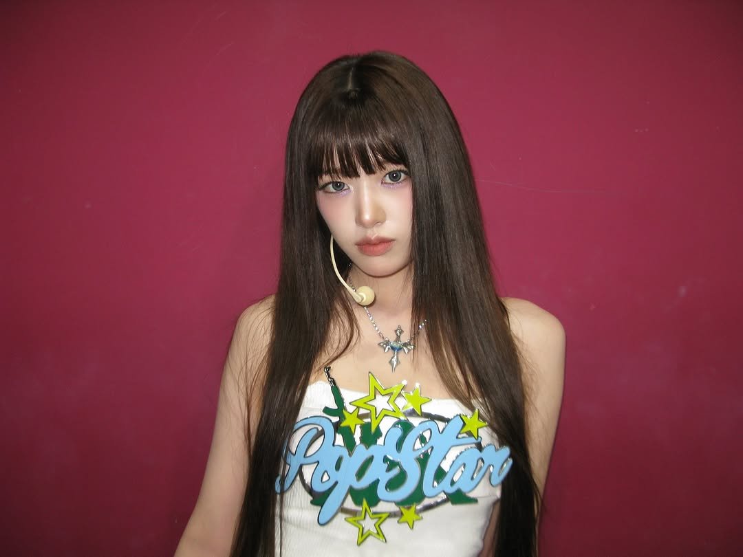 Photo by 안유진 AN YUJIN on August 30, 2025. May be an image of 1 person, bangs, braids, top, bolo tie and text.