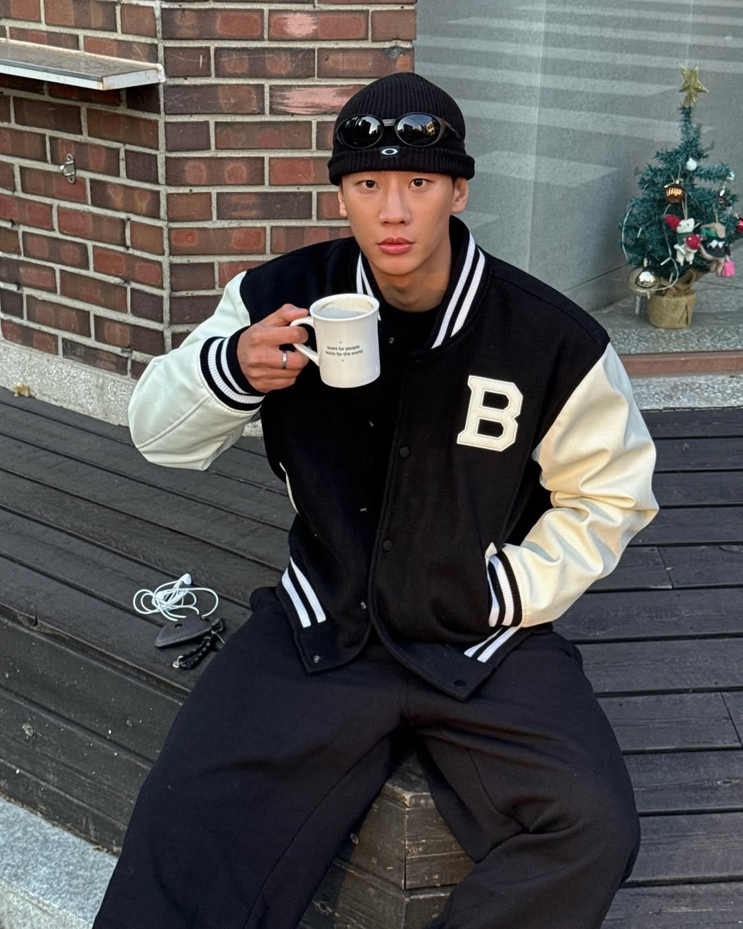 Photo shared by 이지권 JIKWON on December 02, 2025 tagging @borntowin.co.kr. May be an image of hat, flight jacket, parka, sweatpants and text.