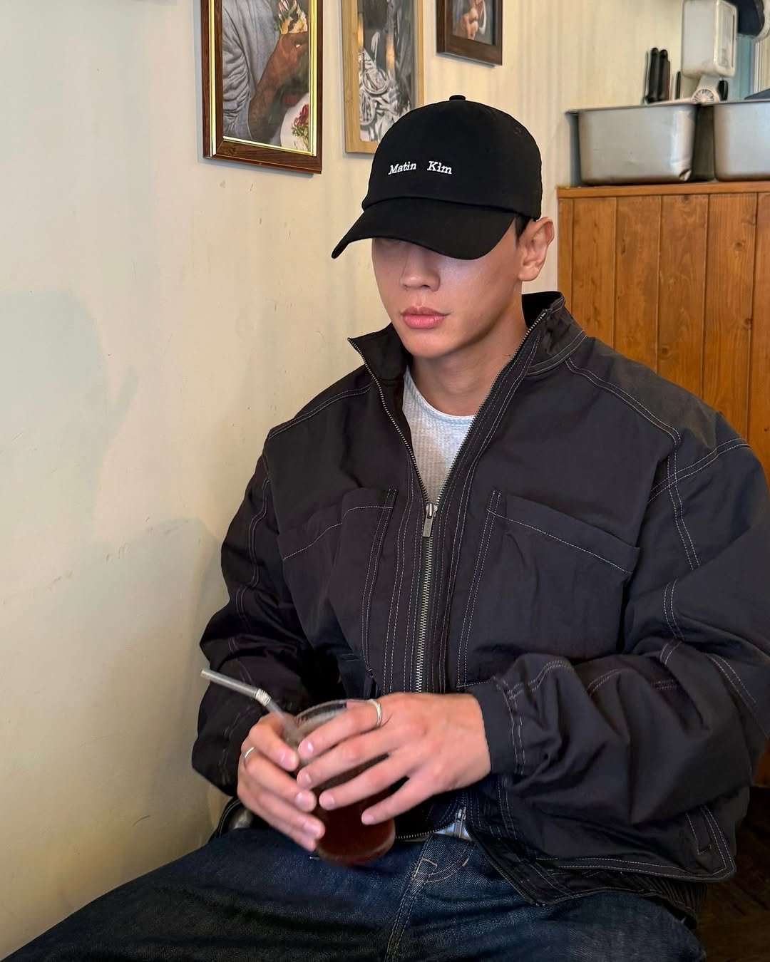 Photo shared by LEEJIKWON on September 26, 2025 tagging @matinkim_magazine. May be an image of 1 person, duffle coat, hat, parka, jacket and text.