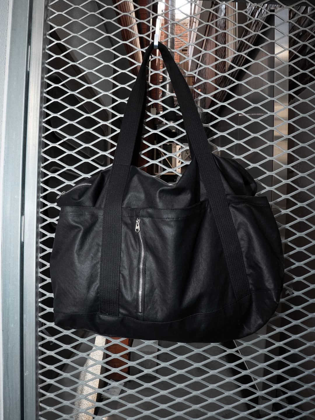 Photo by AAOA on March 27, 2026. May be an image of tool bag, leather, grocery bag, sling, purse and text.