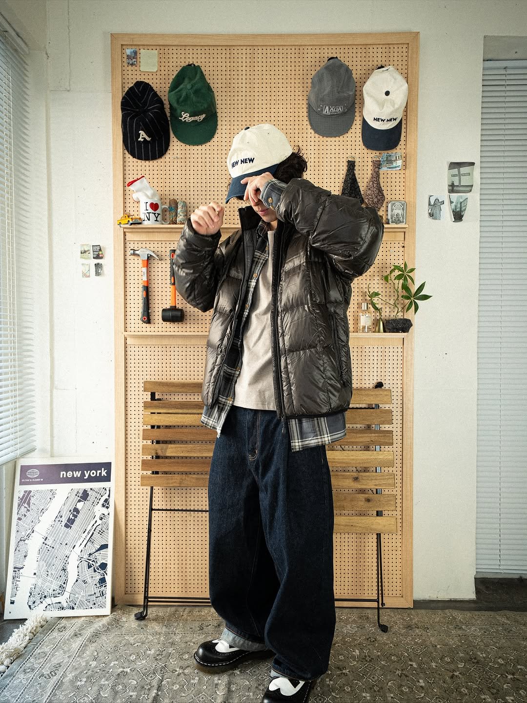 Photo by AAOA on November 12, 2025. May be an image of duffle coat, hat, parka, beret, hat shop and text.