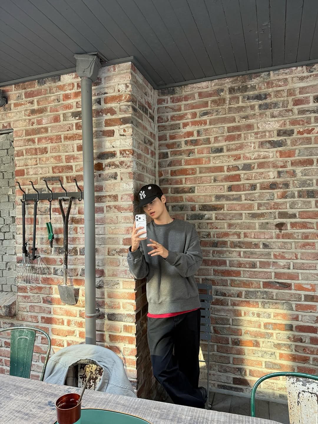 Photo by 차학연 on November 02, 2025. May be an image of smoking, brick wall and text.