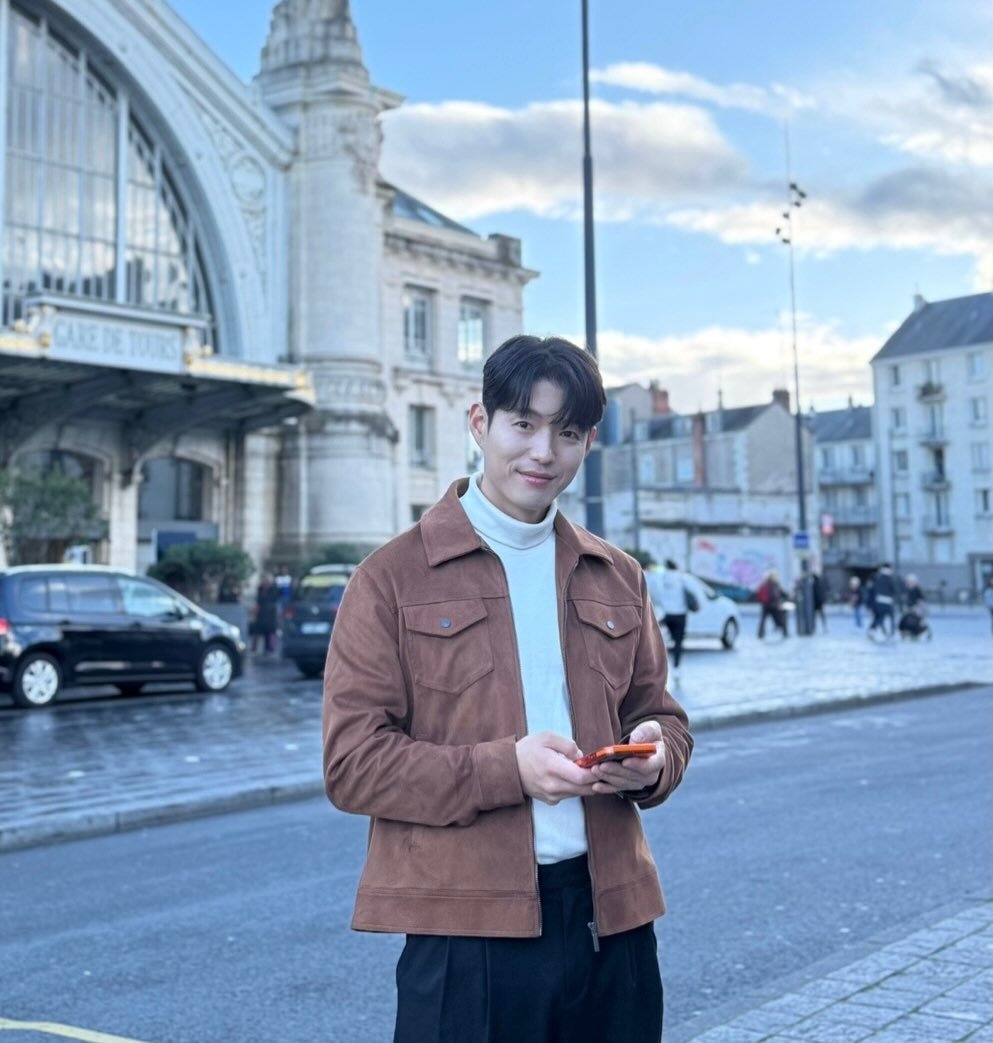 Photo by 하준   Ha_Jun on February 28, 2026. May be an image of one or more people, duffle coat, overcoat, turtleneck, York Minster and text.