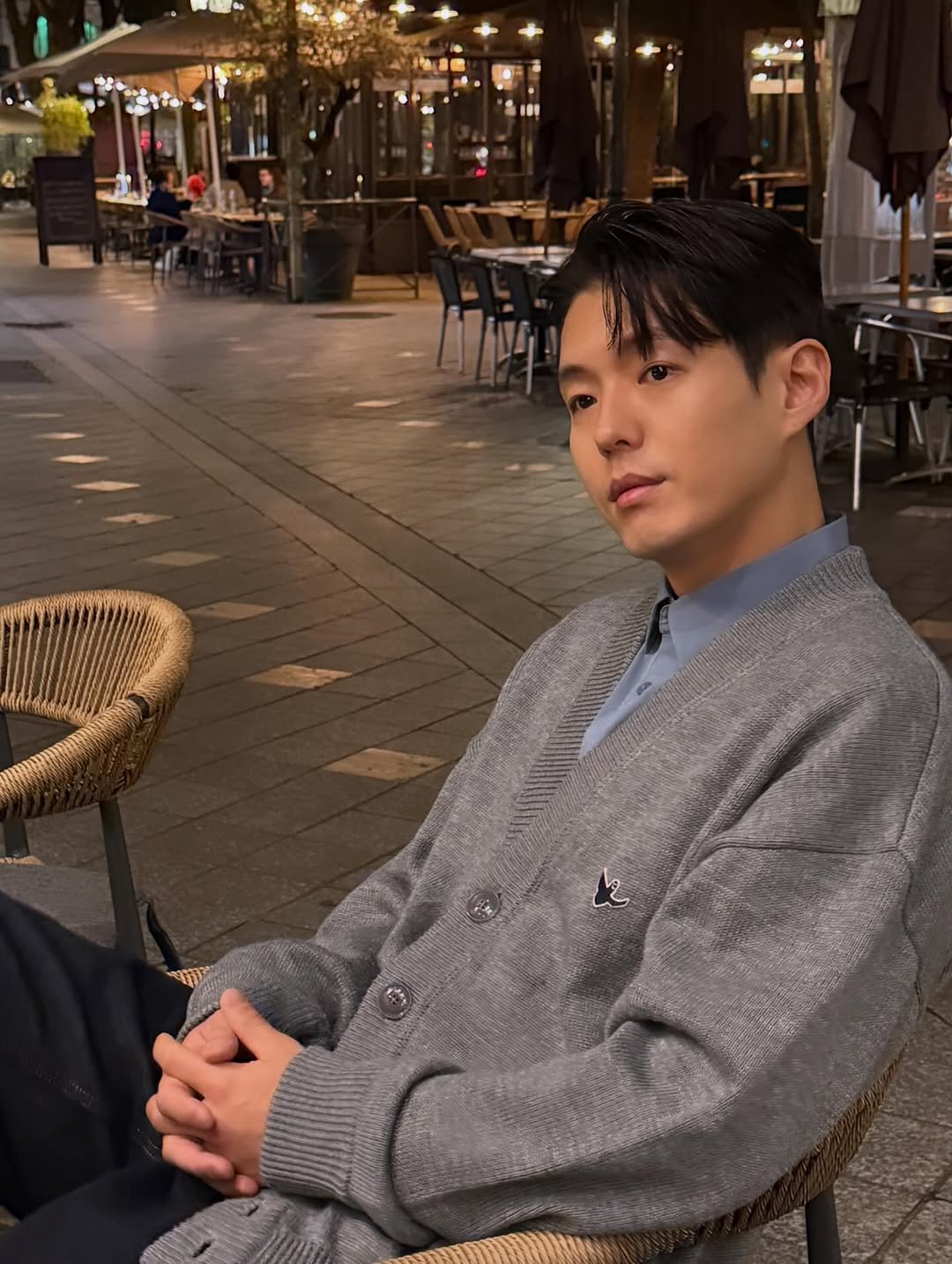 Photo by 하준   Ha_Jun on March 02, 2026. May be an image of one or more people, hair, overcoat, duffle coat, jacket, turtleneck and text.