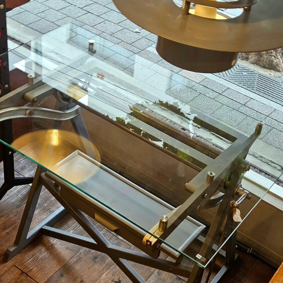 Photo by adel on November 07, 2025. May be an image of table, brass, rack, display case, dining table and text.