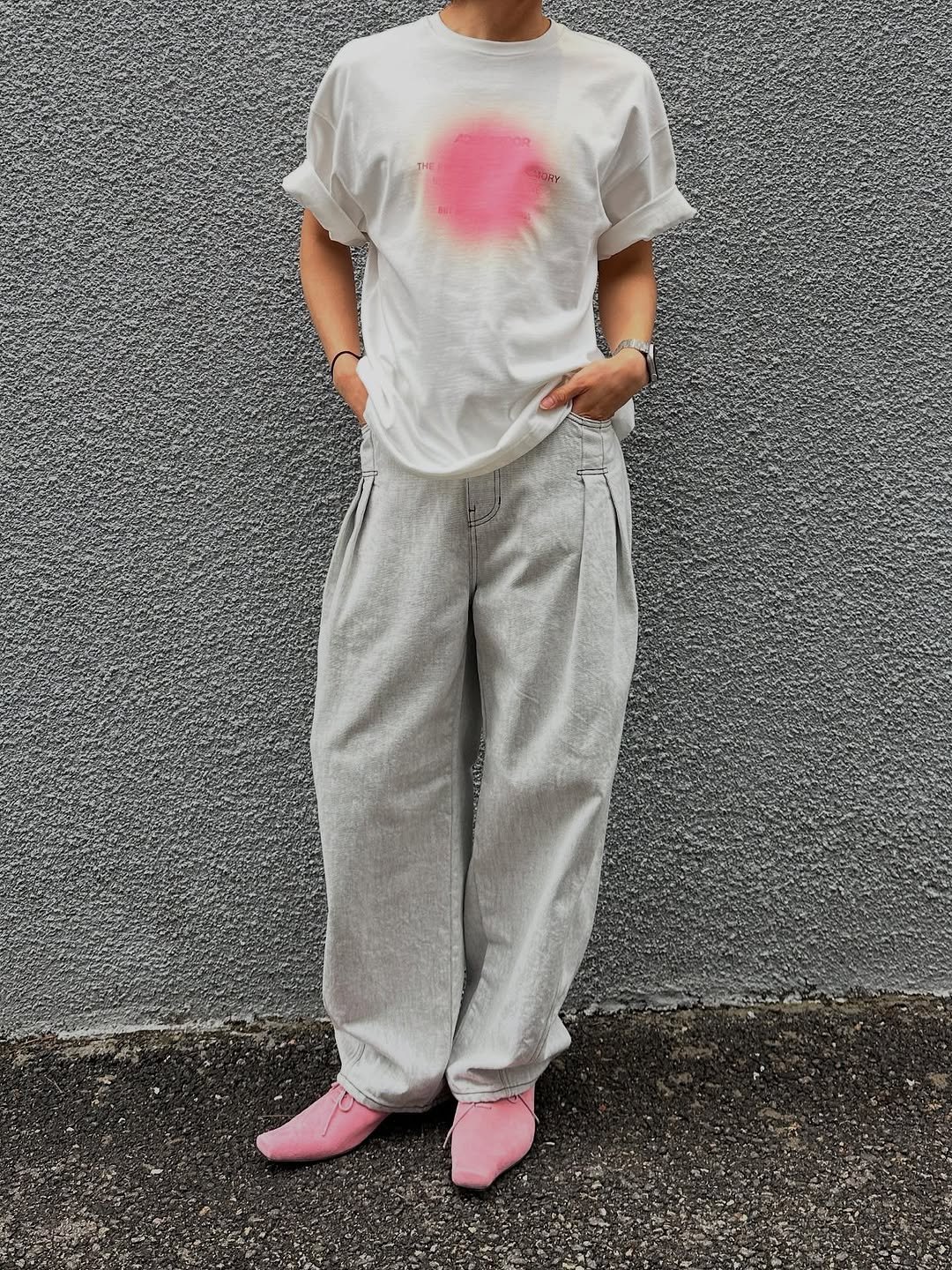Photo by ADERERROR SPACE on July 09, 2025. May be an image of sleepwear, sweatsuit, sweatpants and text.
