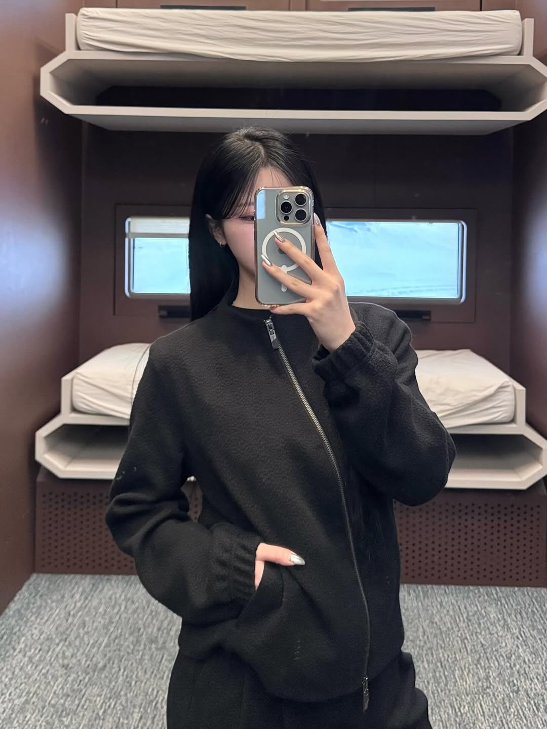 Photo by ADERERROR SPACE on January 30, 2026. May be an image of duffle coat, sweatpants, parka, turtleneck, sweatshirt, jacket, fleece and text.