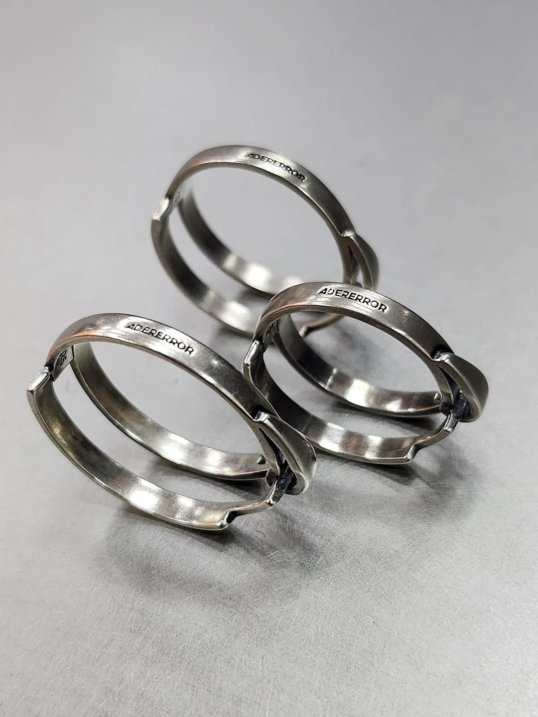 Photo by ADERERROR SPACE on July 23, 2025. May be an image of ring and text.