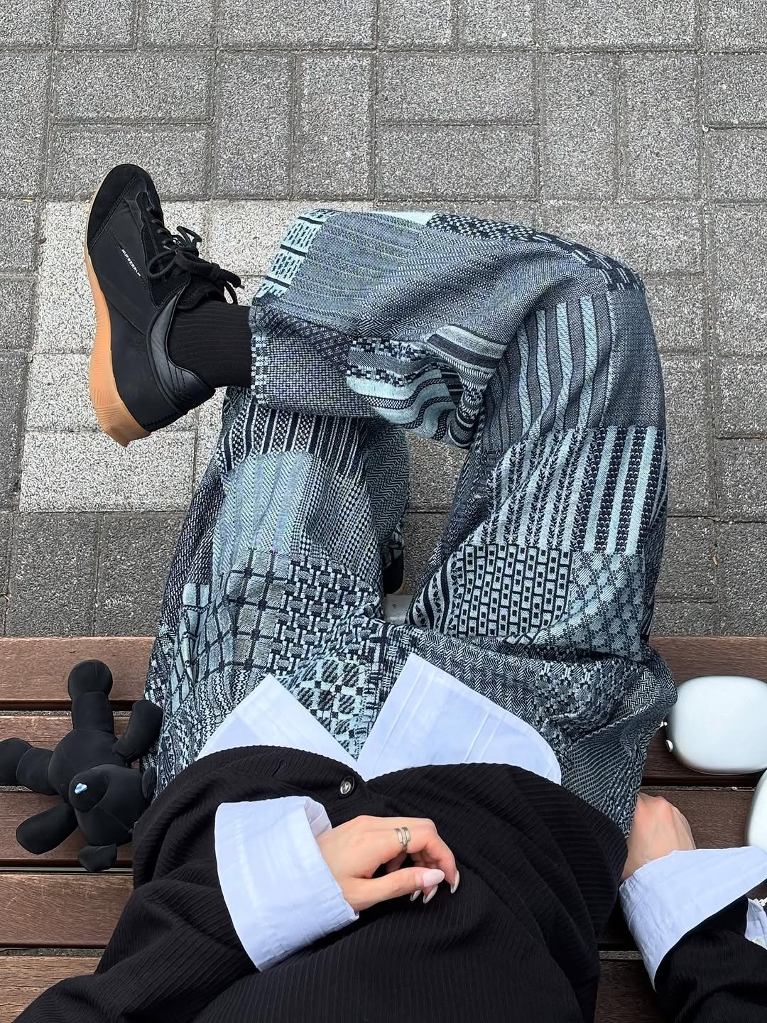 Photo by ADERERROR SPACE on June 29, 2025. May be an image of footwear, sportswear and sweatpants.