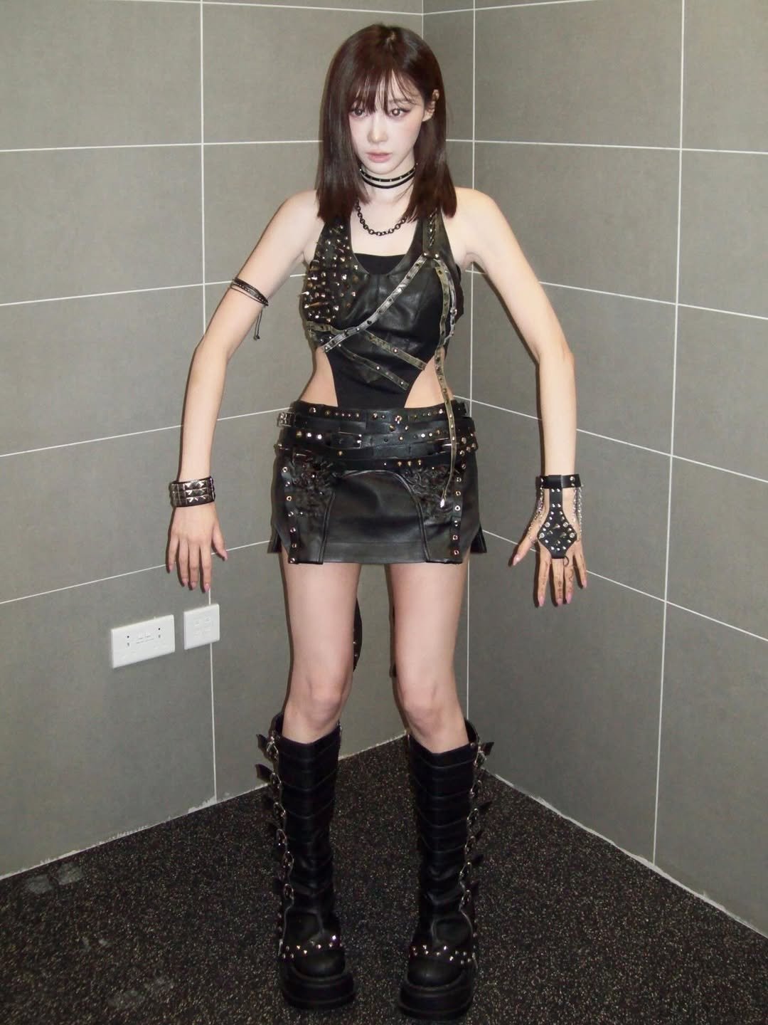 Photo by GISELLE on November 30, 2025. May be an image of leather, glasses, miniskirt, fishnet stockings and text.