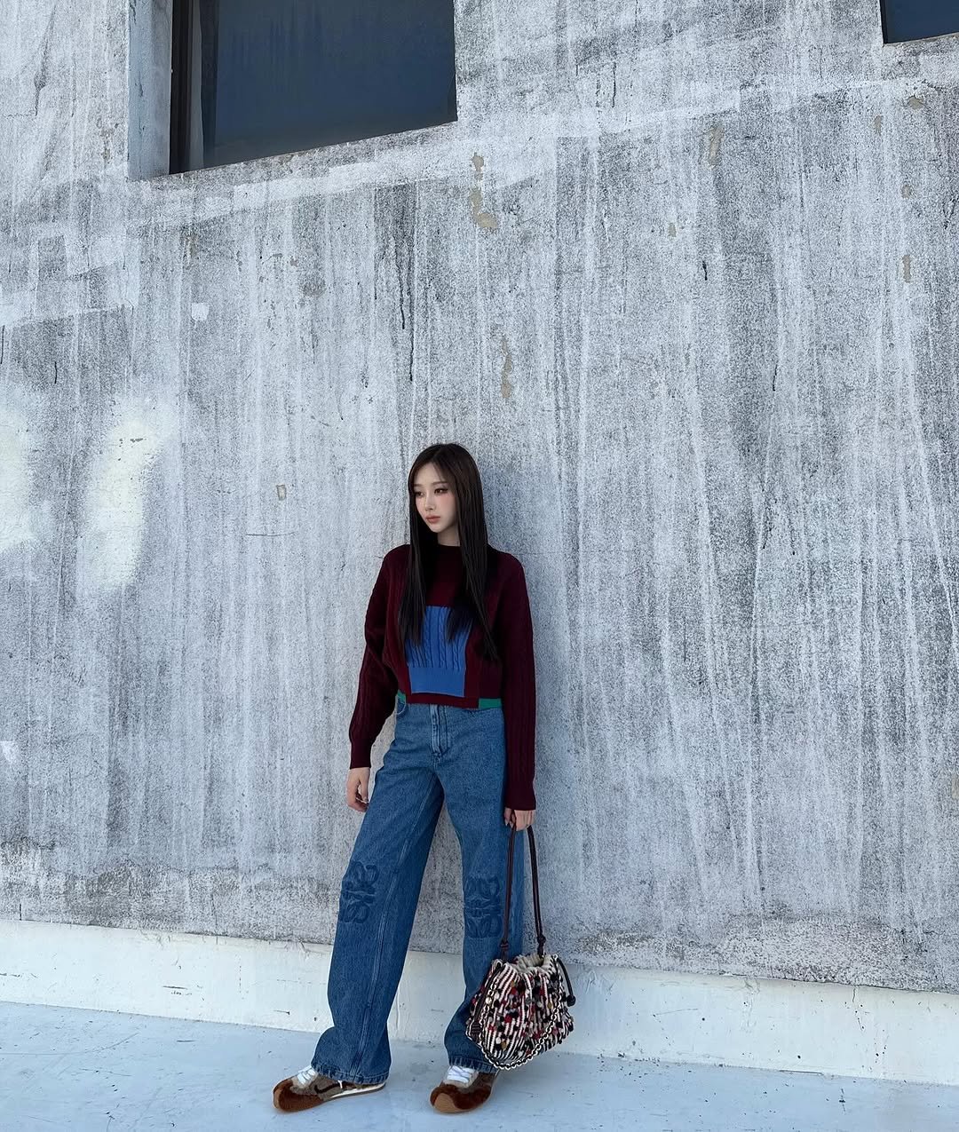 Photo shared by GISELLE on September 02, 2025 tagging @loewe. May be an image of 1 person, outerwear and text.