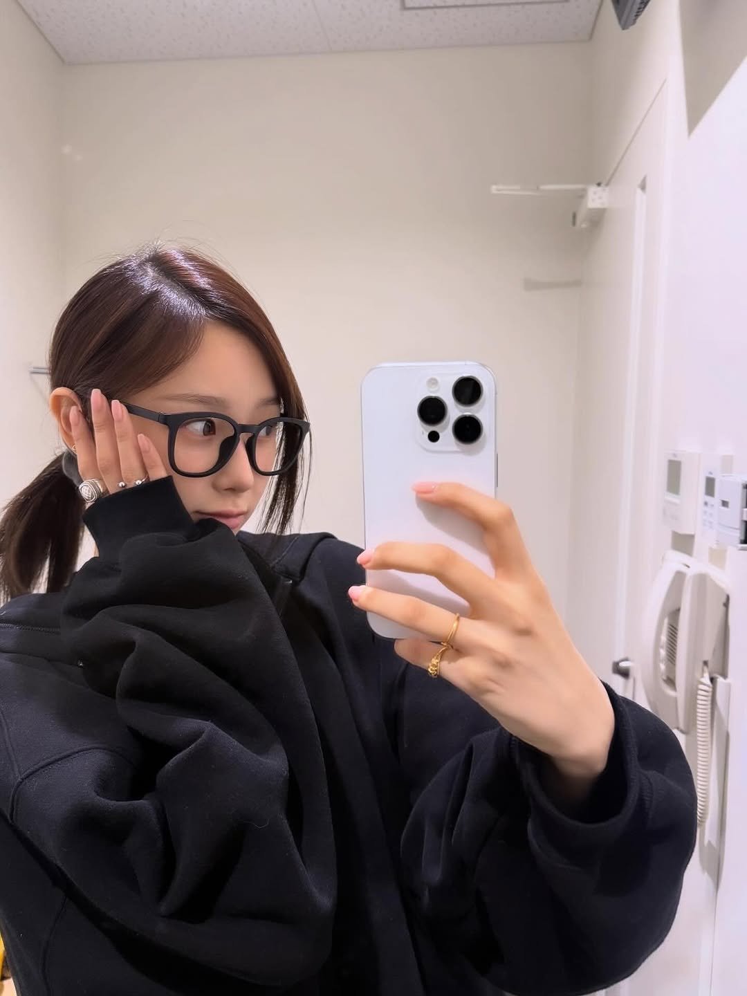 Photo by GISELLE on November 10, 2025. May be a selfie of one or more people, hair, phone, duffle coat, eyeglasses, mirror and text.