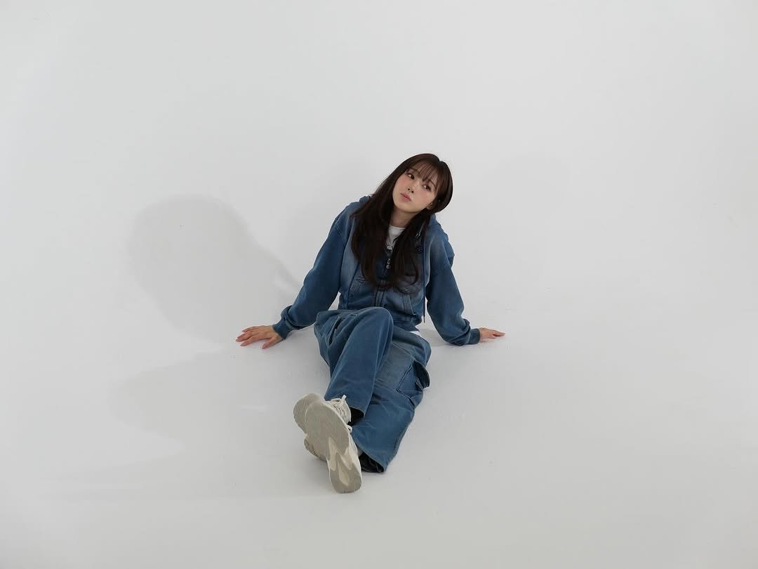 Photo shared by GISELLE on September 22, 2025 tagging @wackywilly_kr. May be an image of 1 person, sleepwear, sweatpants, jumpsuit, sweatsuit and text.