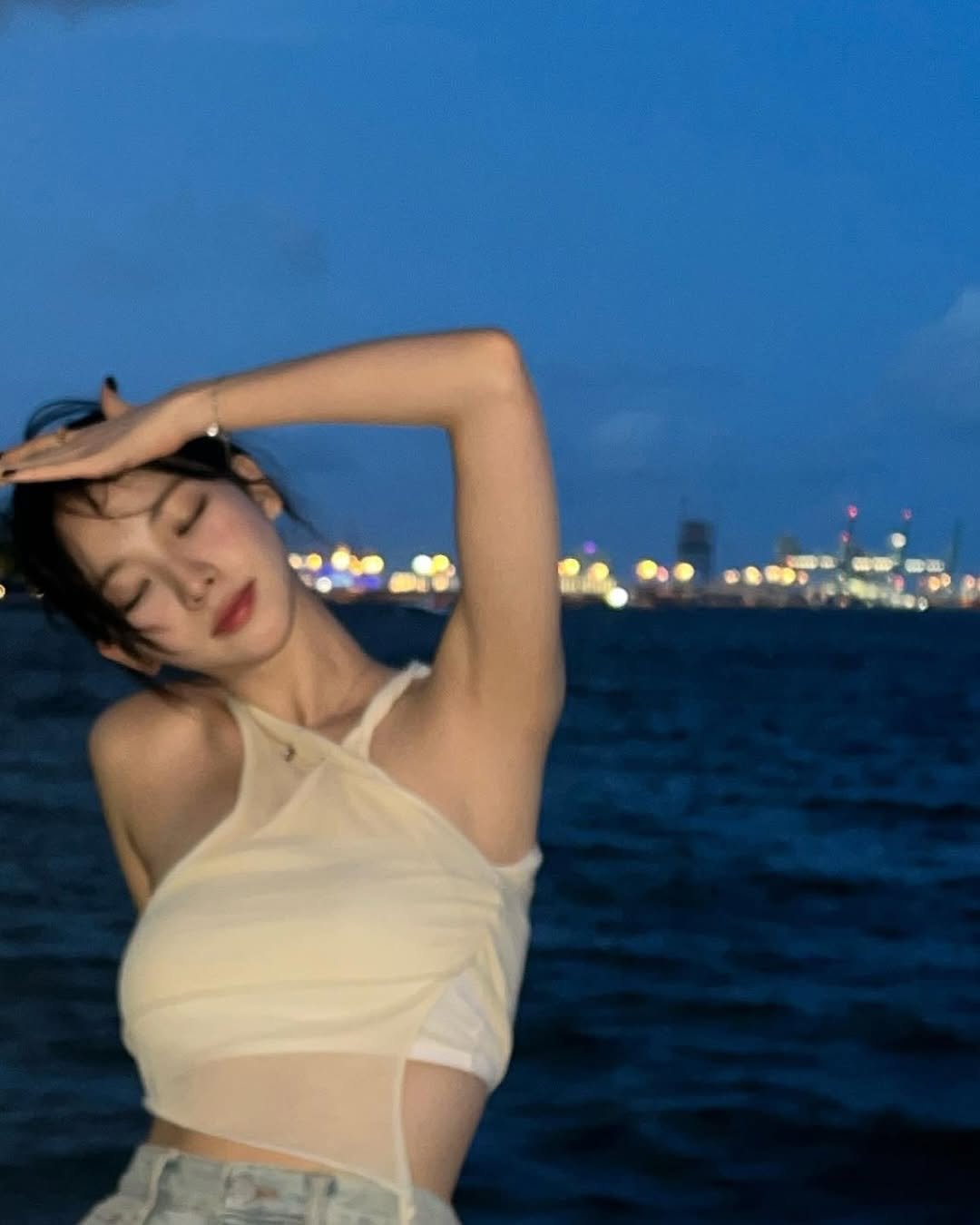 Photo by AESPA KARINA 카리나 on March 25, 2026. May be an image of one or more people, hair, slip, top, bra and text.