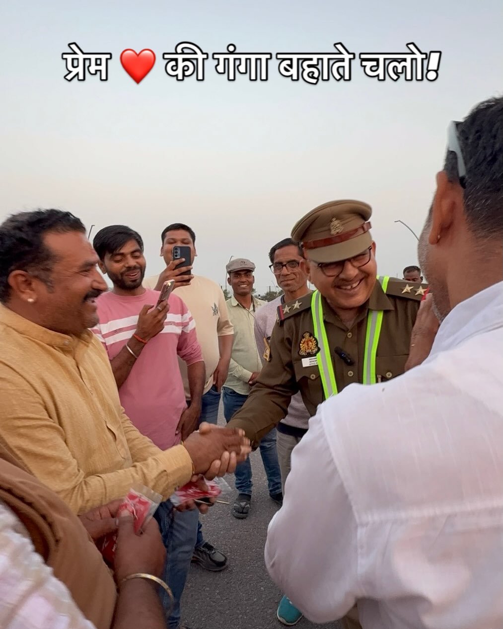 Photo by Afaq Khan on February 19, 2026. May be an image of one or more people, people standing and text that says 'प्रेम की गंगा बहाते चलो!'.