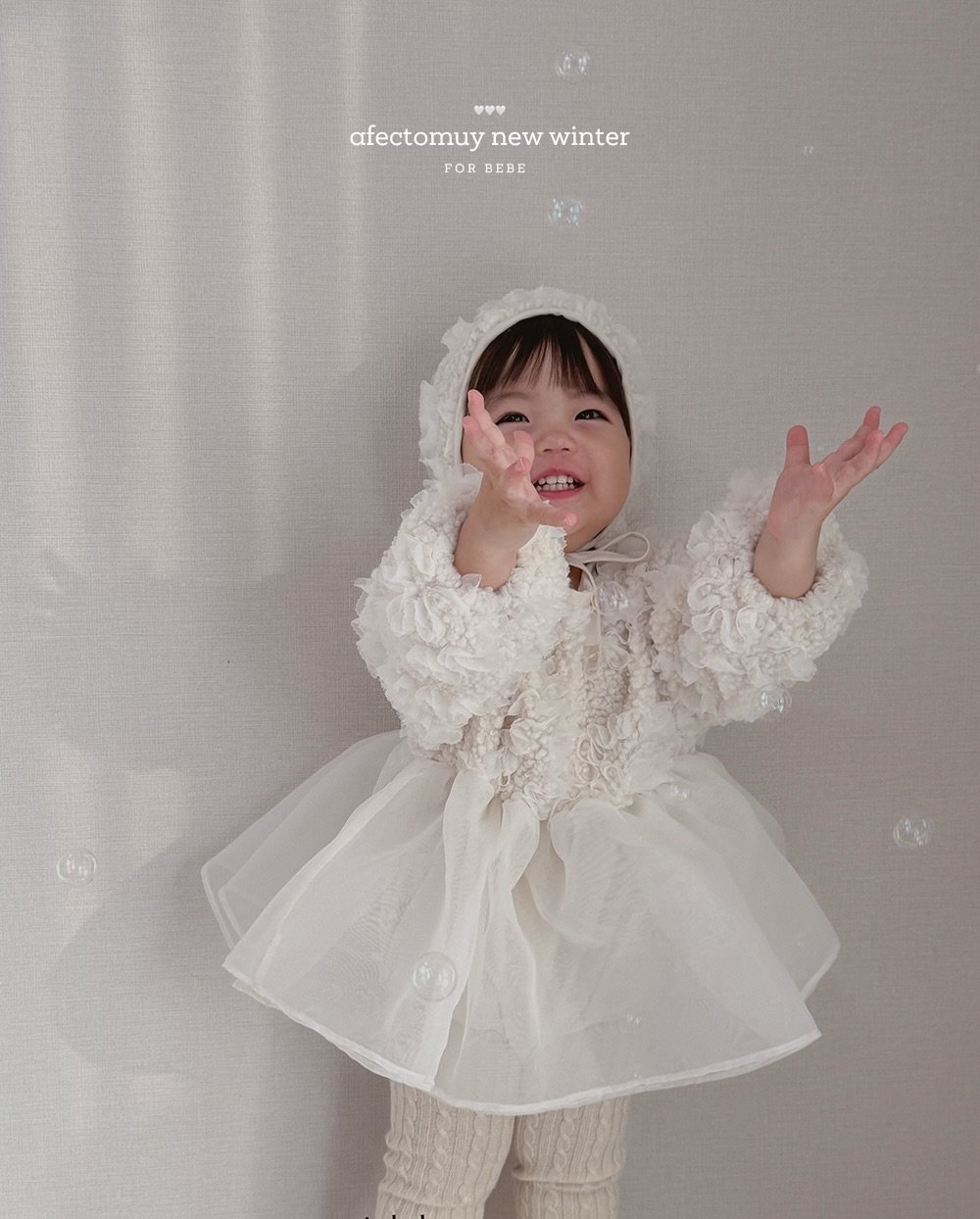 Photo by 아펙토무이 on December 17, 2025. May be an image of baby, dress, overskirt and text that says 'afecomuyTewwinter ទ afectomuy afectomuynewwinter new winter FOR FORBEBE R BEBE'.
