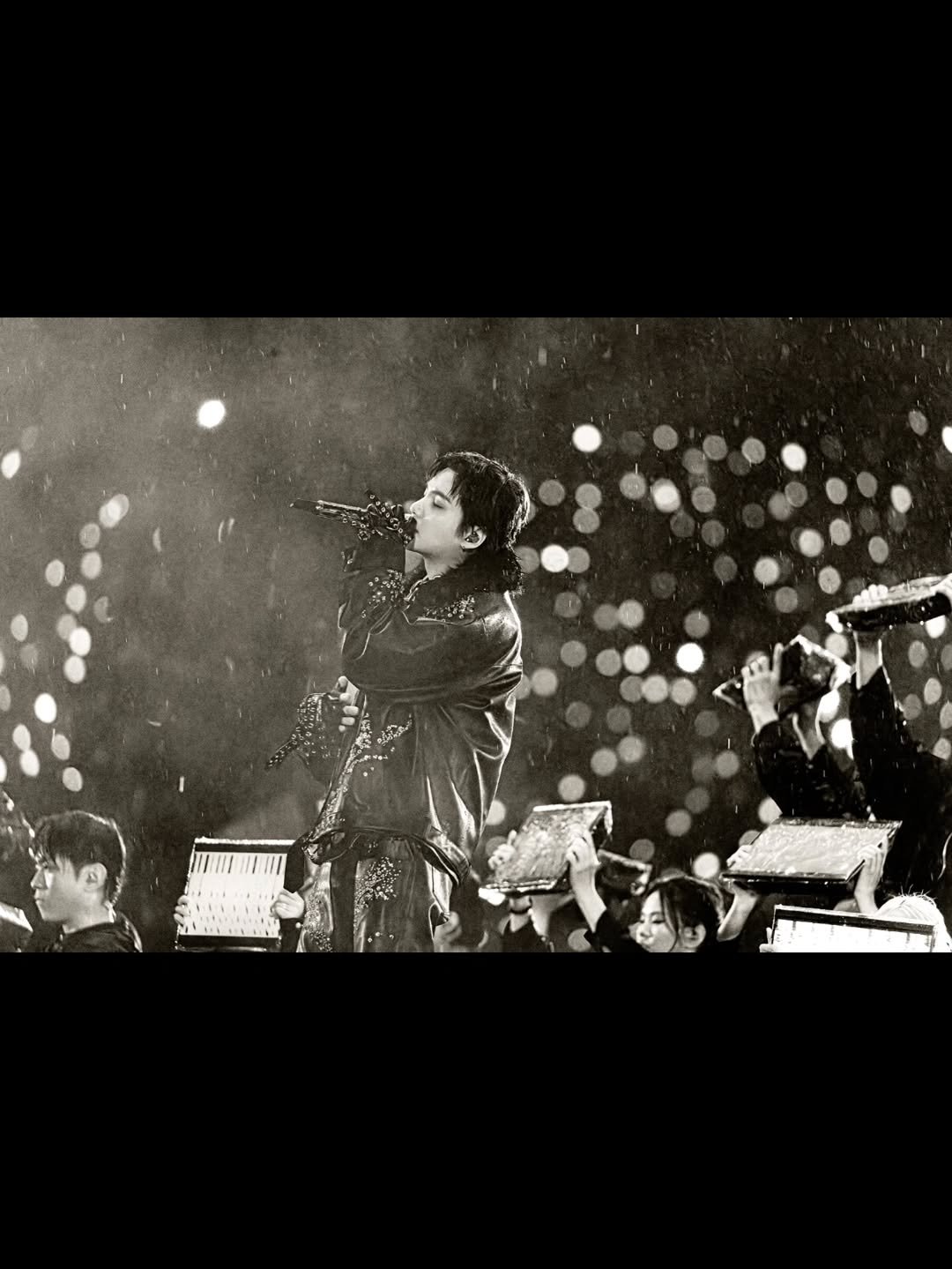 Photo by SUGA of BTS 민윤기 on April 13, 2026. May be a black-and-white image of concert and text.