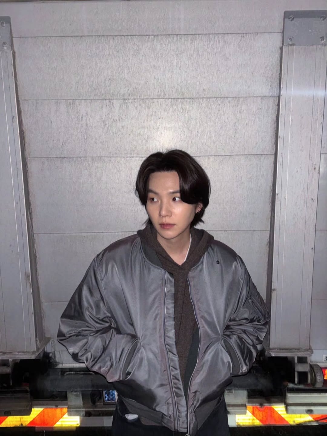 Photo by SUGA of BTS 민윤기 on January 31, 2026. May be an image of one or more people, bangs and top.