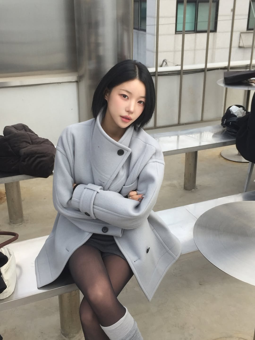 Photo by 소윤🐬 on February 17, 2026. May be an image of one or more people, hair, duffle coat, overcoat, jacket, tights, turtleneck, parka and text.