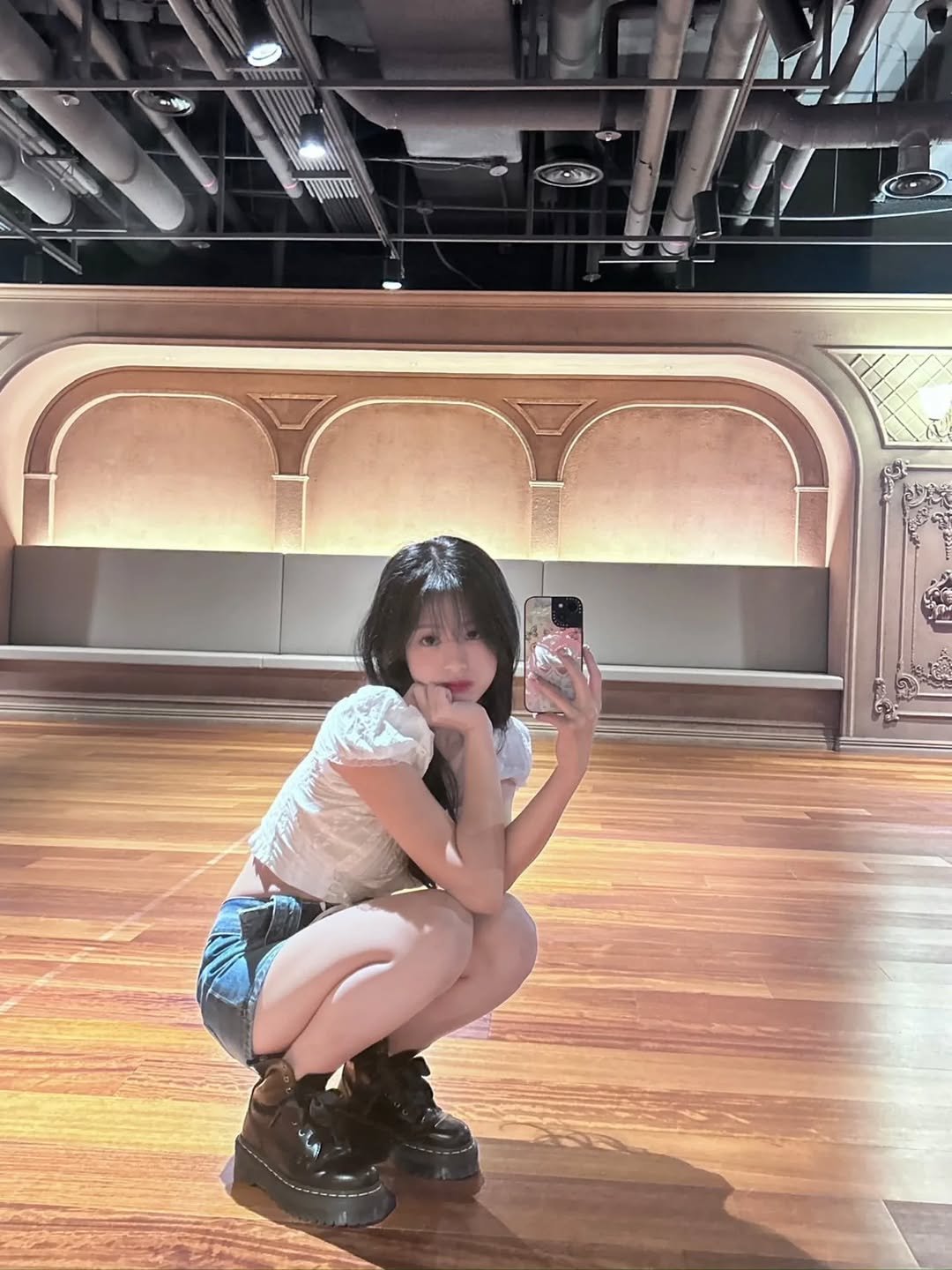 Photo by BABYMONSTER AHYEON 아현 on December 17, 2025. May be an image of costume, miniskirt and boots.