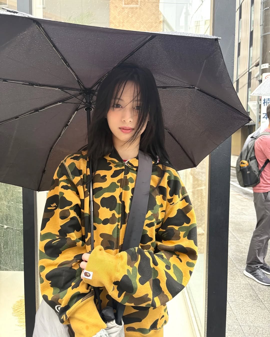 Photo by BABYMONSTER AHYEON 아현 on October 29, 2025. May be an image of raincoat, umbrella, parka, parasol, jacket and text.