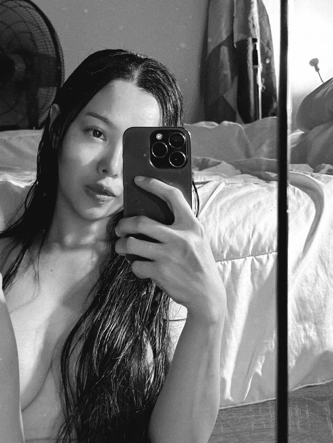 Photo by ไอเนะ ยูคิมุระ on December 04, 2025. May be a black-and-white image of phone, mirror and text.