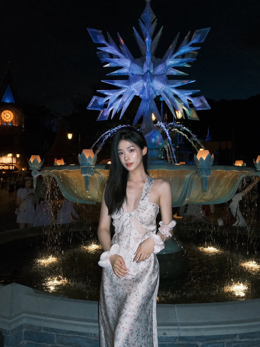 Photo shared by 차아정 | ajung on June 28, 2025 tagging @disney. May be an image of 1 person, dress, fountain and text.