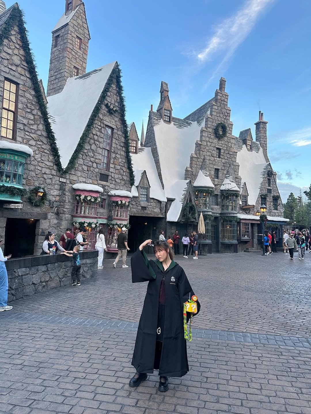Photo shared by 이수현 on November 19, 2025 tagging @unistudios, and @kim_bora95. May be an image of cloak, bath robe, castle and text.