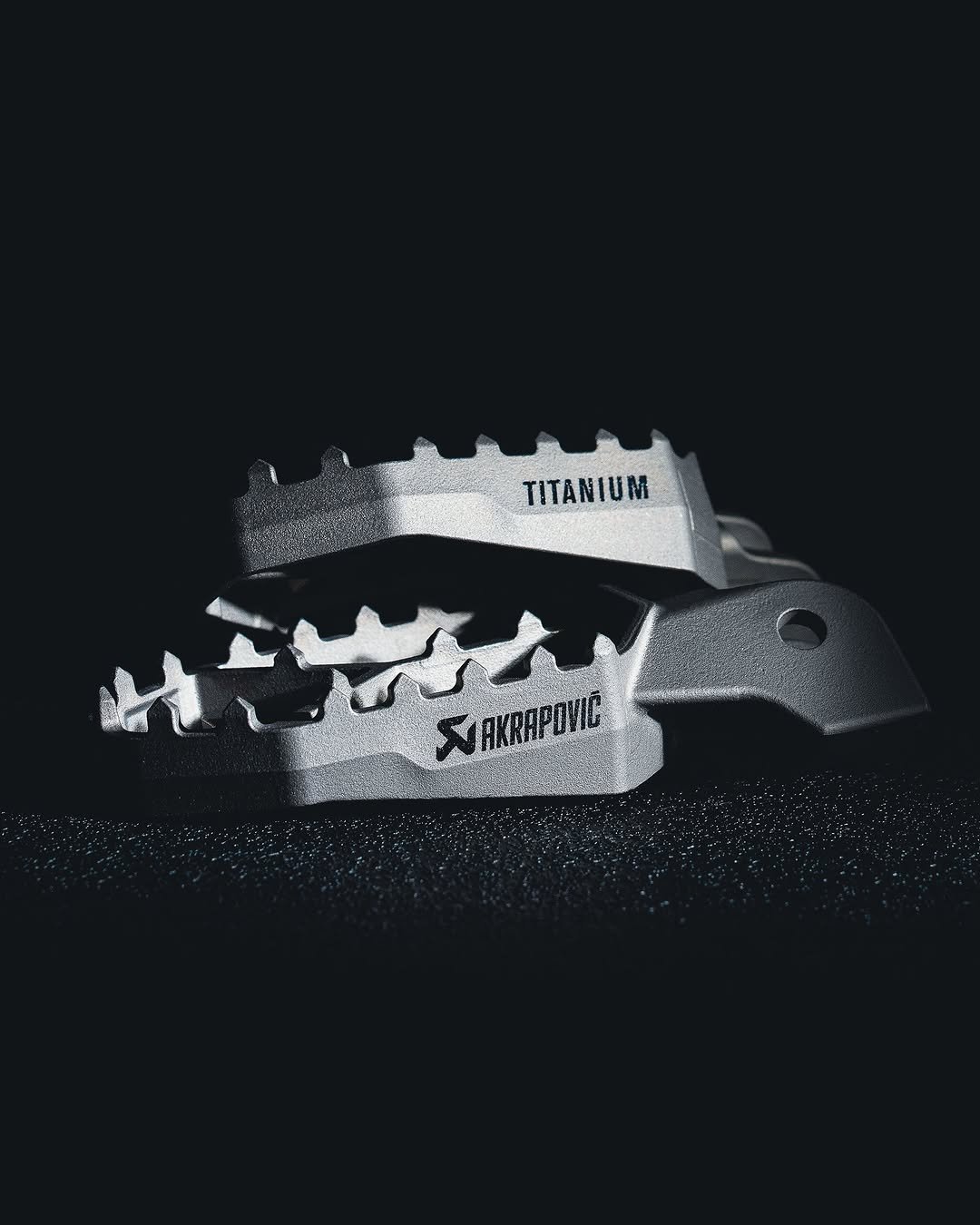 Photo by Akrapovič Exhaust System on April 13, 2026. May be an image of knife, pocket knife, toecap shoes, cutter and text that says 'TITANIUM VAKRAPONIC'.