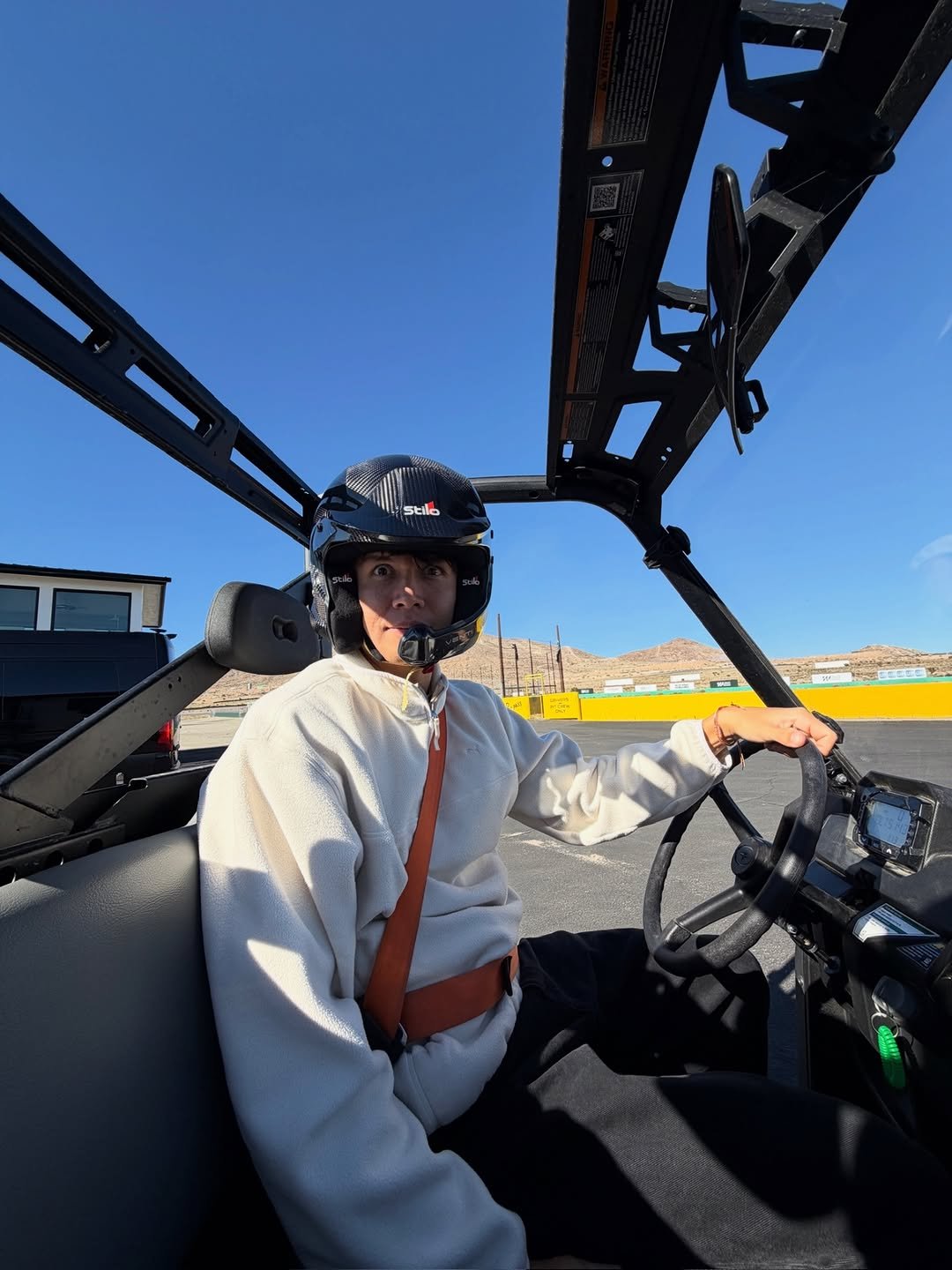 Photo by Alex Albon on November 25, 2025. May be an image of helicopter, golf cart, buggy, glasses, dune buggy and text.