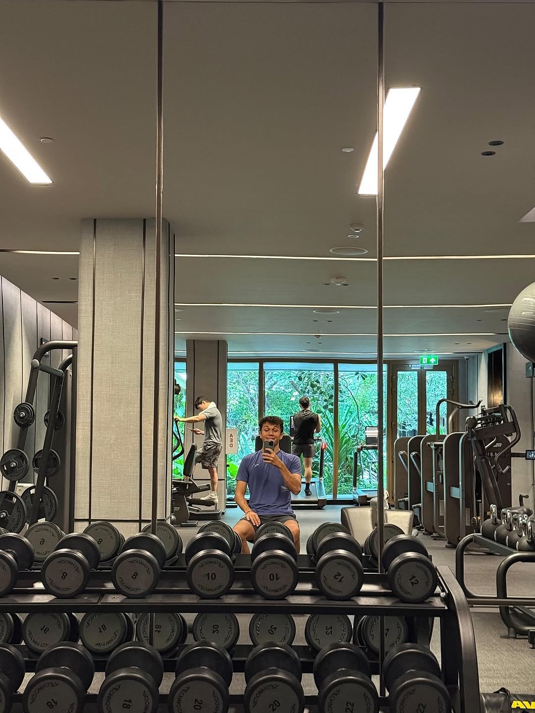 Photo by Alex Albon on October 11, 2025. May be an image of one or more people, biceps, mirror, treadmill, dumbbell and text.