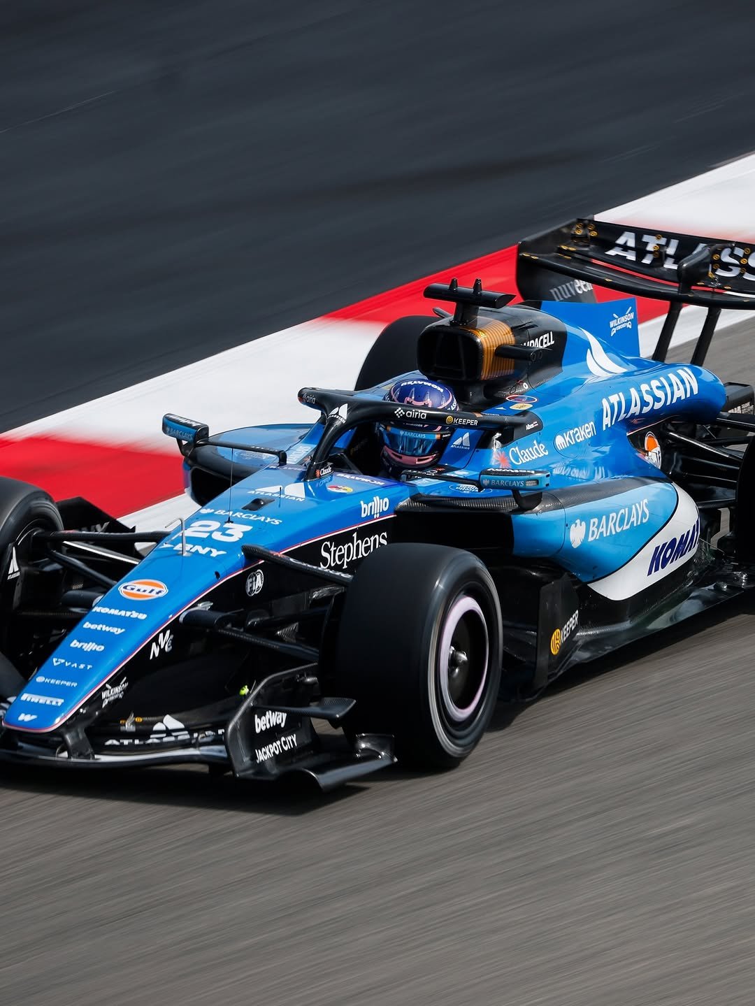 Photo shared by Alex Albon on February 21, 2026 tagging @williamsf1official. May be an image of racing vehicles, race car and text.