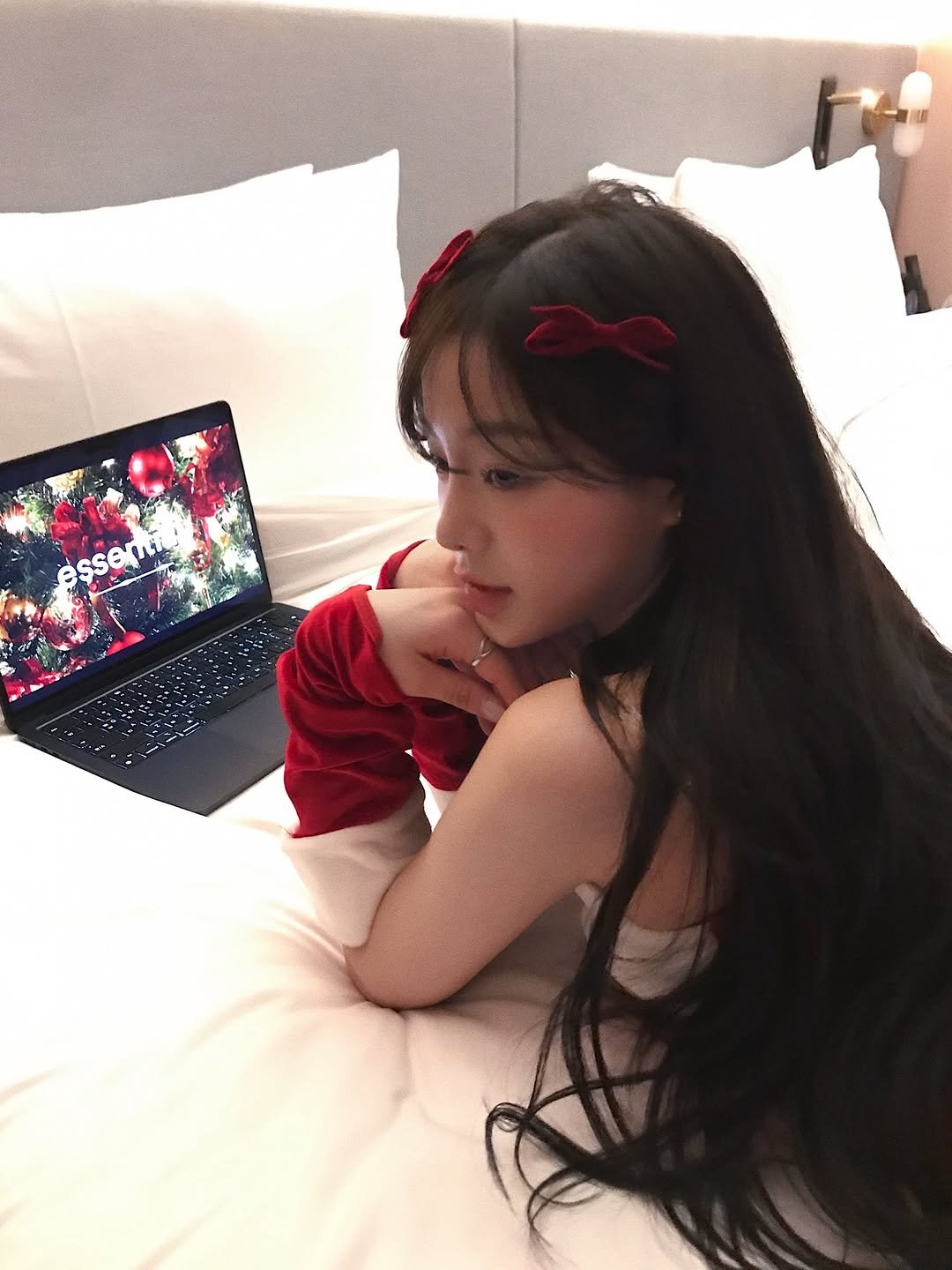 Photo by 다영 ALLZEROK on December 25, 2025. May be an image of one or more people, hair, sleepwear, tablet, bed and text.