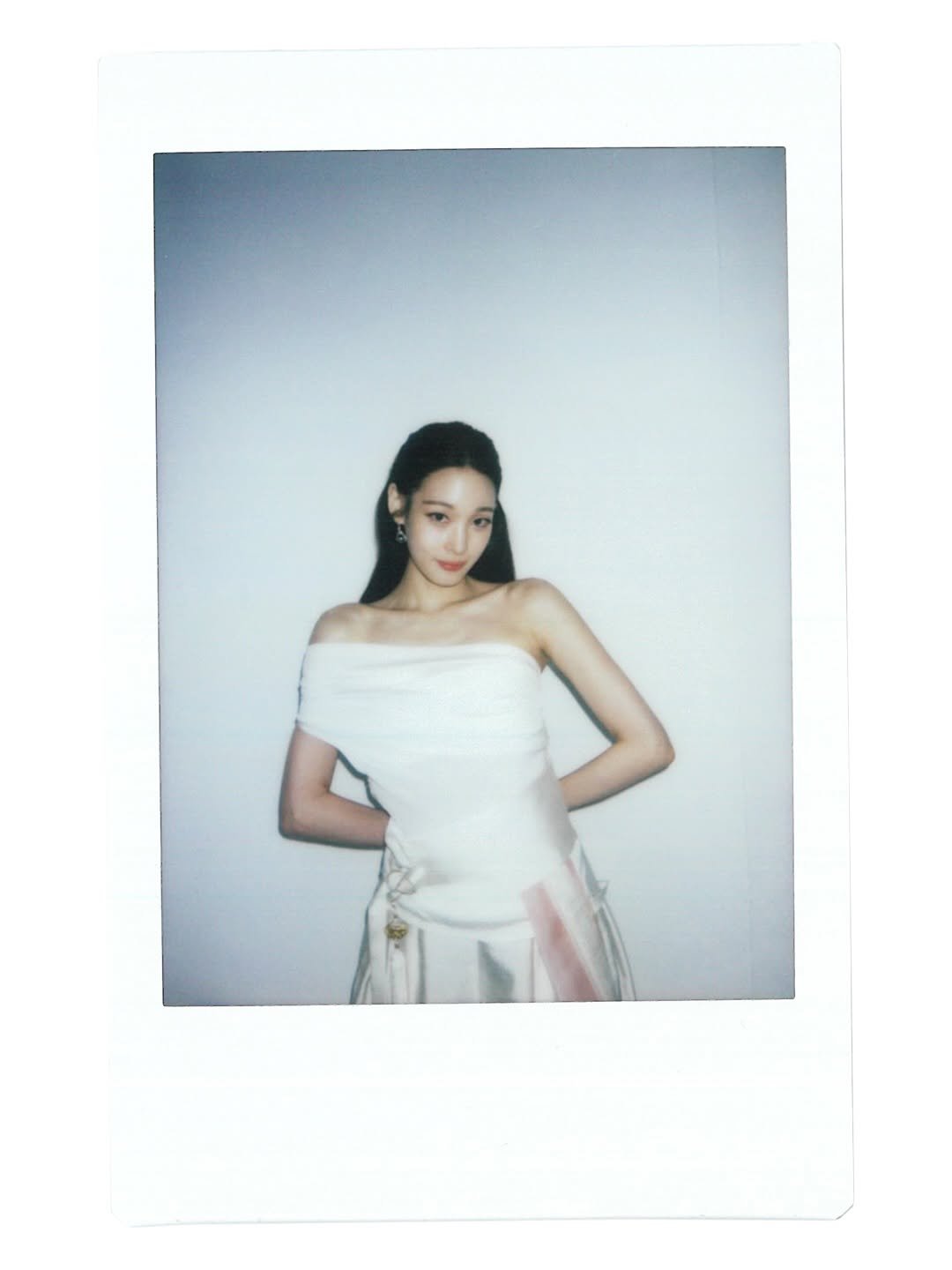 Photo shared by ALLDAY PROJECT on February 28, 2026 tagging @clio_official. May be an image of one or more people, hair, makeup, polaroid, dress and text.