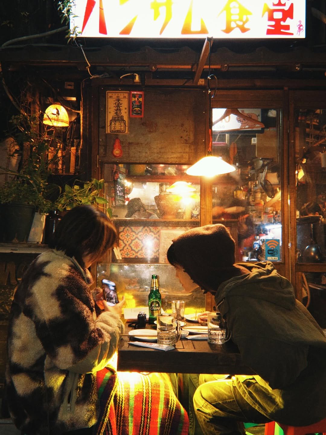 Photo by 융 Ashley on December 27, 2025. May be an image of one or more people, signboard, newsstand, street and text.