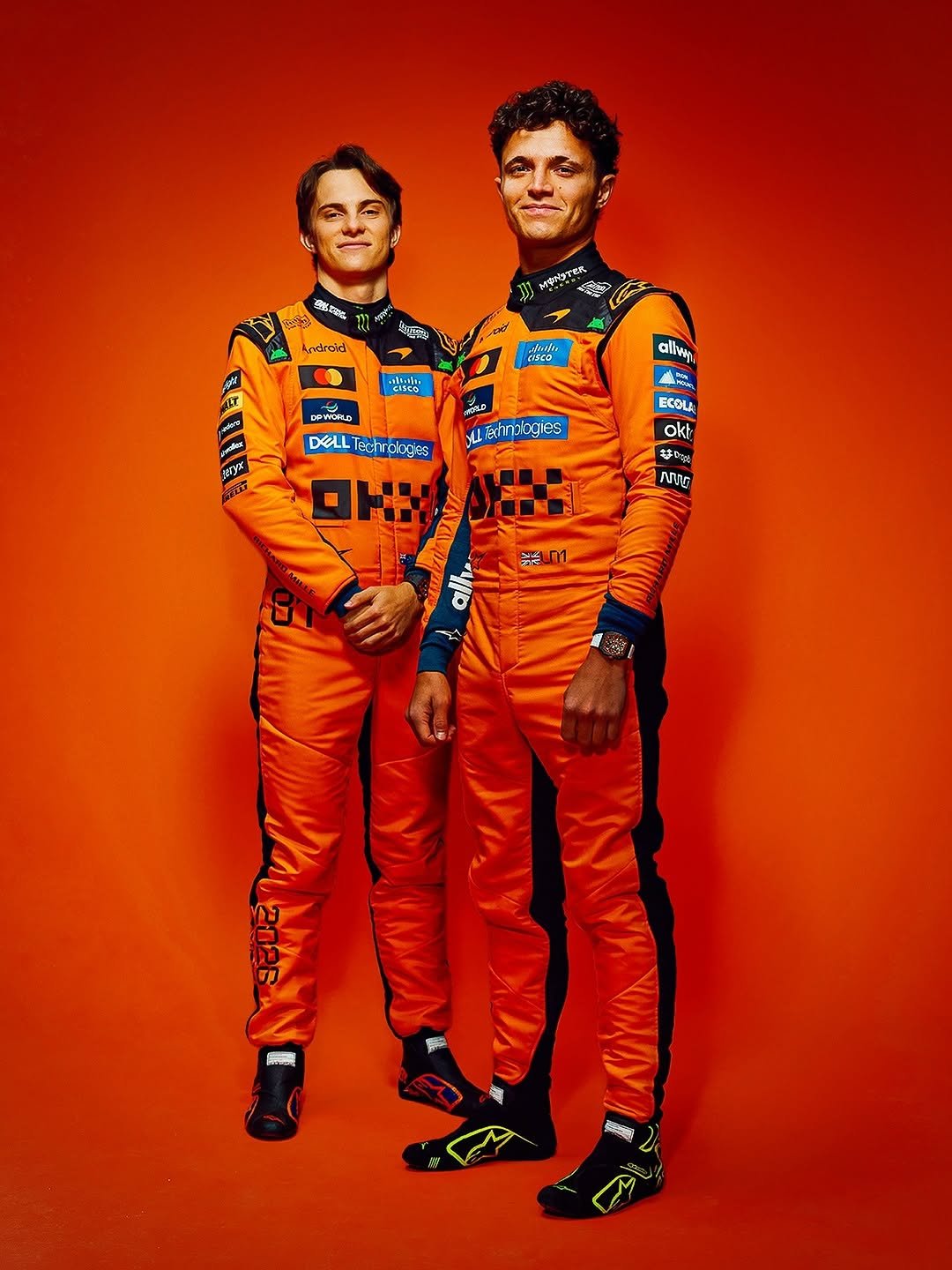 Photo shared by Alpinestars on February 12, 2026 tagging @mclarenf1, @lando, and @oscarpiastri. May be an image of racing vehicles, helmet and text.
