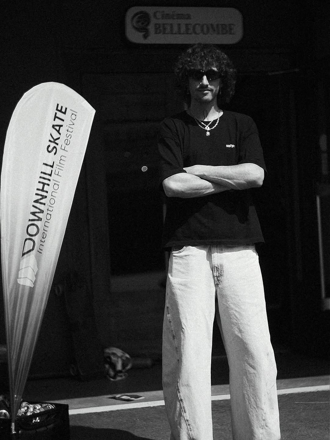 Photo shared by Ambroise Trt on December 05, 2025 tagging @dosif.festival. May be a black-and-white image of standing, skateboard, ski and text that says 'saly SKATE Festival DOWNHILL International Film'.