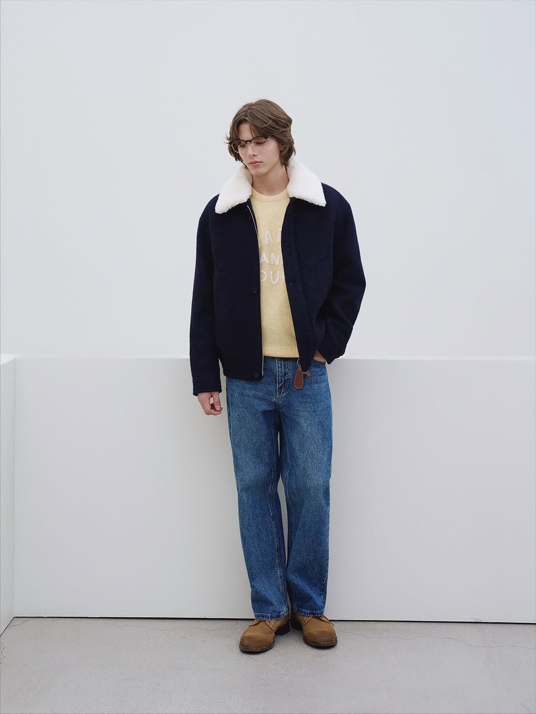 Photo by AMOUPRE 아모프레 on October 13, 2025. May be an image of duffle coat, turtleneck, fleece and text.